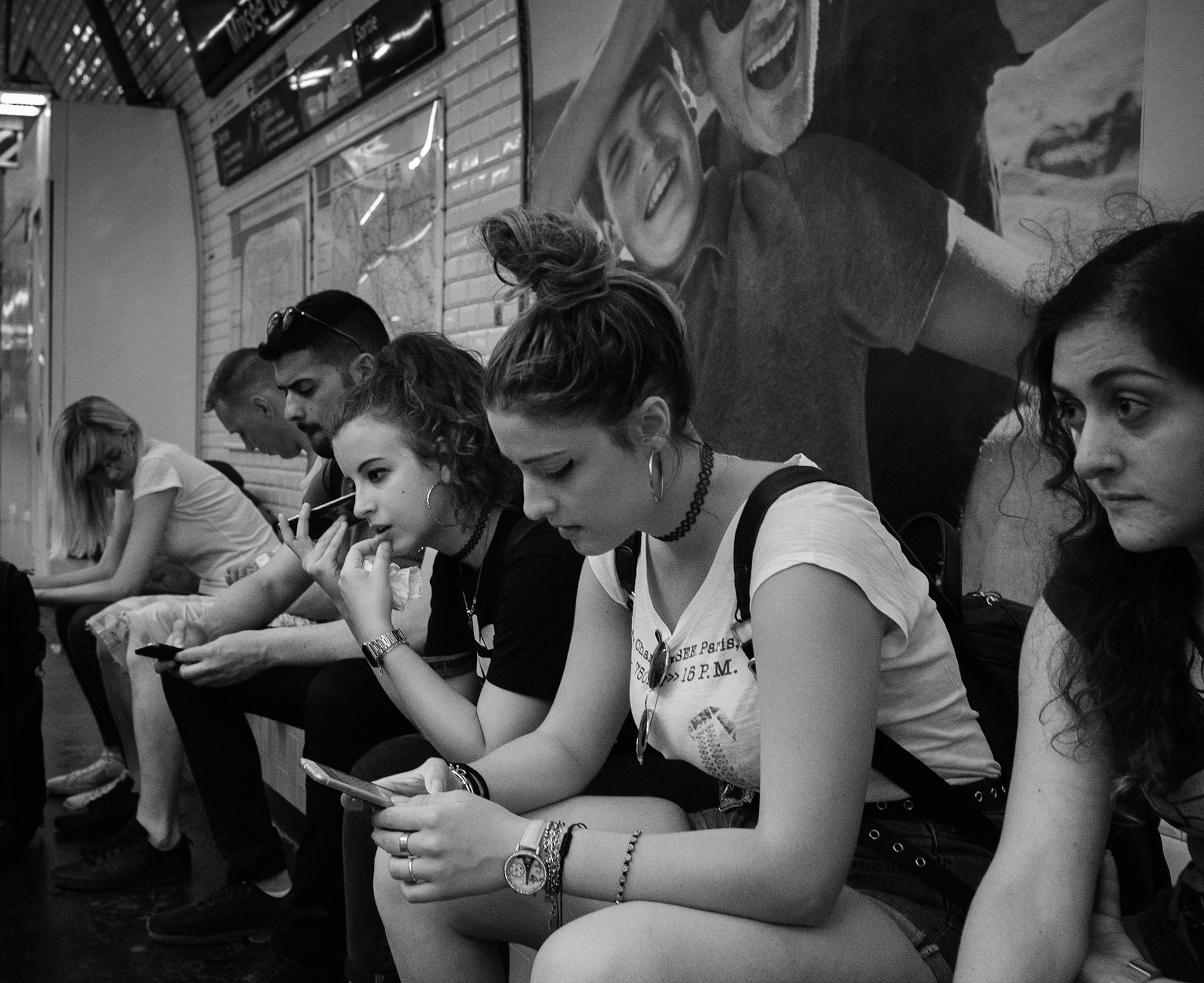 Every person on this photo is deep inside their own thoughts. The photo of two boys on the top is emphasize and hint us about what kind of thoughts the girls in the middle have. Also I like a combination of triangles in composition of the photo. Paris and collar on the girl's neck inspired me to  give a title to the photo "Matilda" (Like Natalie Portman's character in "Leon")