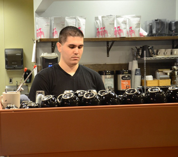 Adam Kissinger makes a cup of coffee at Kaldi’s Coffee on Tuesday, April 3, 2018 in Columbia, Mo. Kissinger decided to work there for 2 years because he appreciates the quality of coffee Kaldi’s serves and has worked as a barista before.