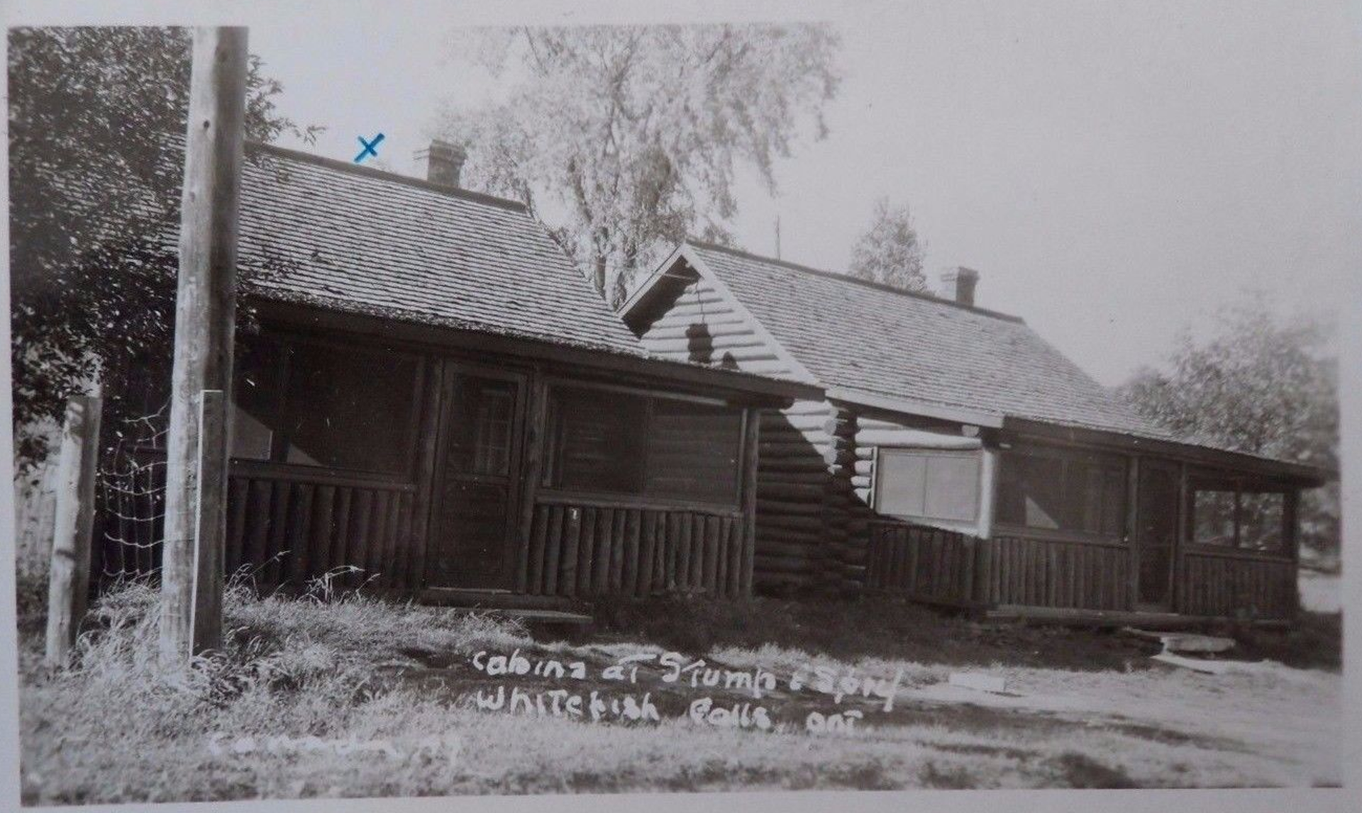 The twin log cabins where Group of 7 artist A. J. Casson stayed at Stump & Sprys ( now River Lodge ) on the Whitefish River in Whitefish Falls.