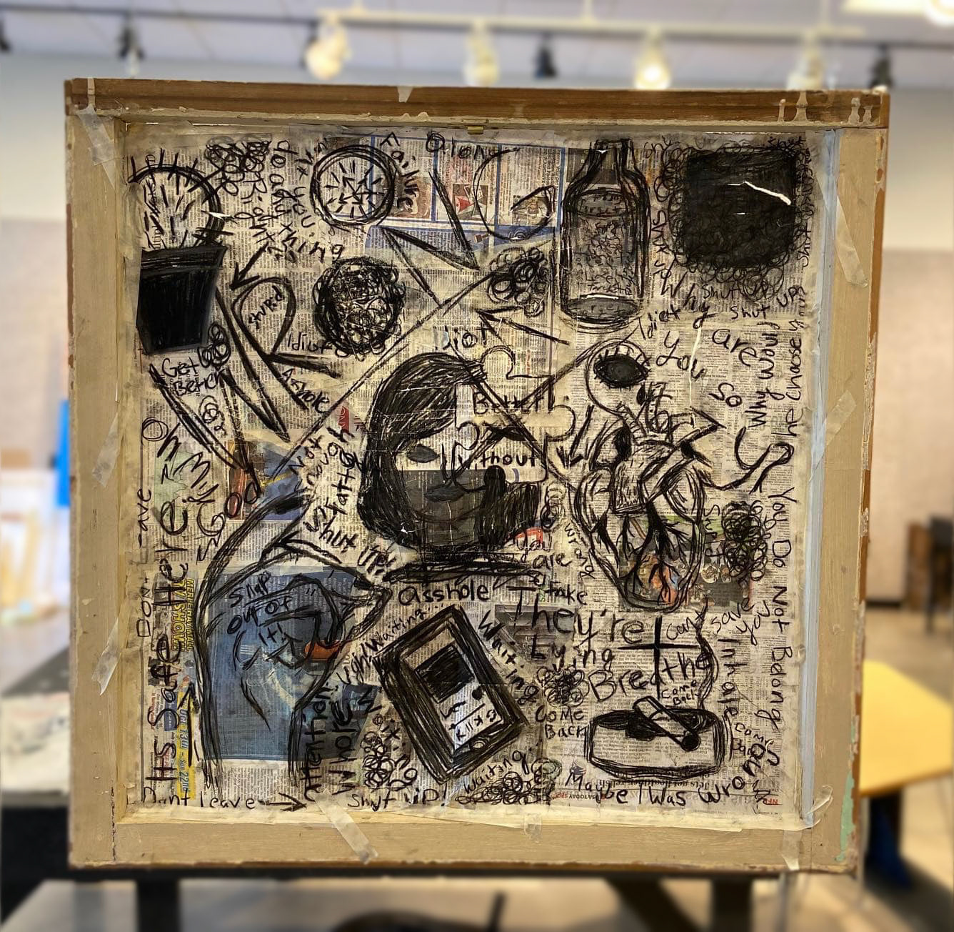 Boundaries - Back (2019) • Recycled window frame, charcoal, and newspaper • 24"x24"