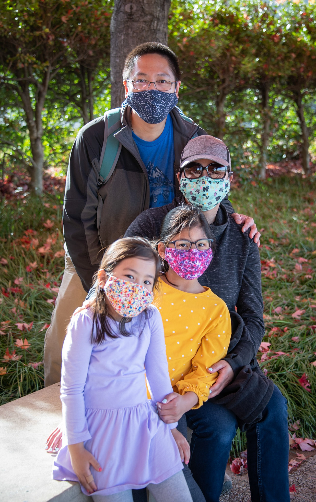 "Do you always wear face masks outside?" There was no hesitation in the response... "Yes".I don't often have a chance to interview such young humans (behind the face mask). So, I decided to ask the girls, "Do you have any favorite face masks?" They both nodded yes. Mom added, "They're wearing their favorites." "I can see why", I said "Those are very pretty masks!" I then asked the girls, "Do the masks make you feel safe?" They both nodded yes again. Mom told me that they're used to wearing masks now. They both get in the car and immediately put them on.As I walked away, I looked back and noticed the family had wandered over to the fallen leaves and had begun playing with them. Mom and Dad were obviously enjoying time with their girls. It was nice to see a family having fun together while staying safe.