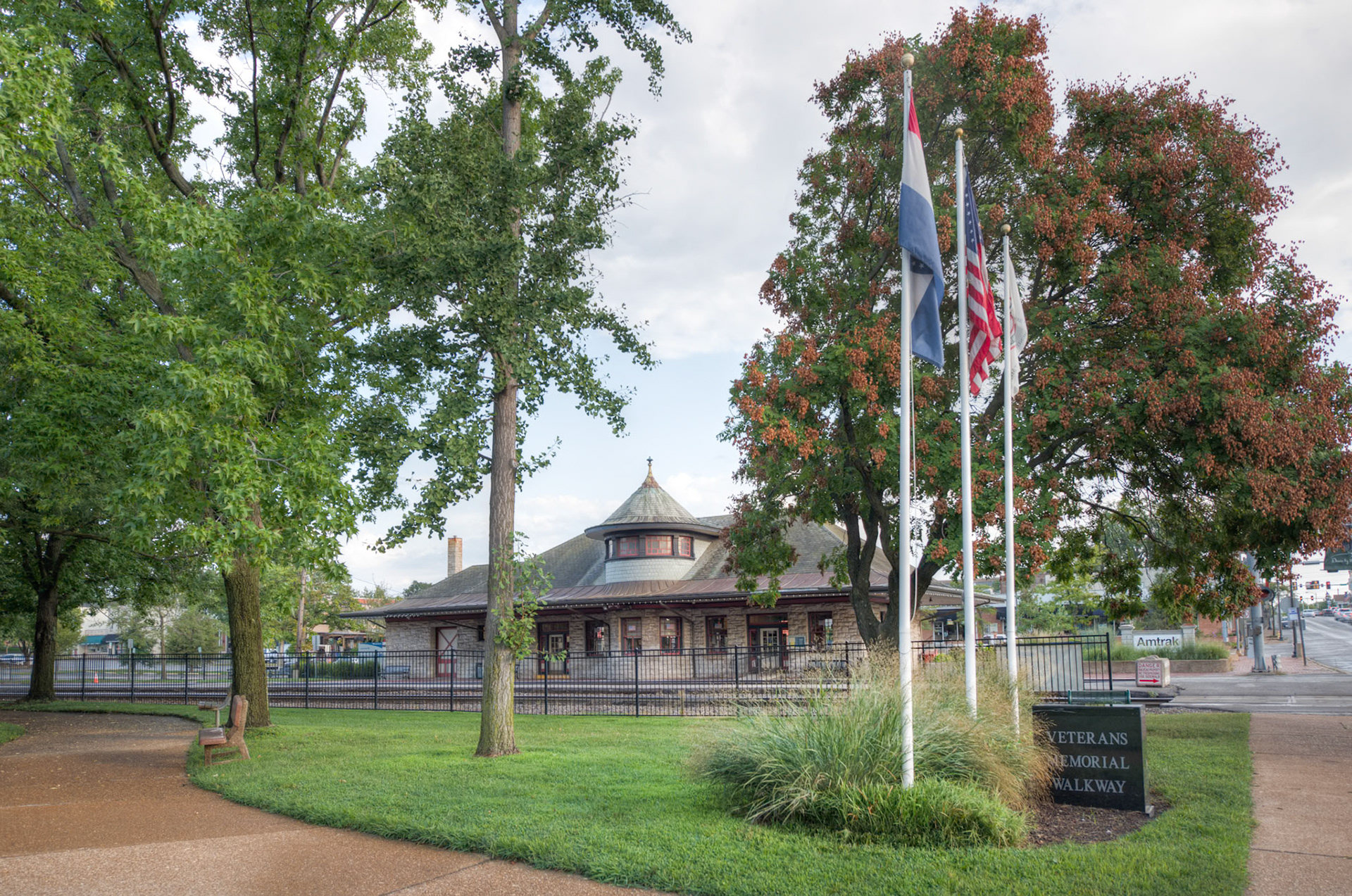 The Kirkwood Train Station is an example of Richardsonian architecture and was constructed by Douglass Donovan to replace a previous wooden station. The track for the Pacific Railroad to Kirkwood was completed in 1853. The first train arrived May 11, 1853, for an auction sale of lots, making Kirkwood the first planned suburb west of the Mississippi. The town was named for the chief engineer for the railroad, James P. Kirkwood. Commuter trains ran to and through Kirkwood until 1961. It is still an active station for Amtrak service and also serves as a visitors center.