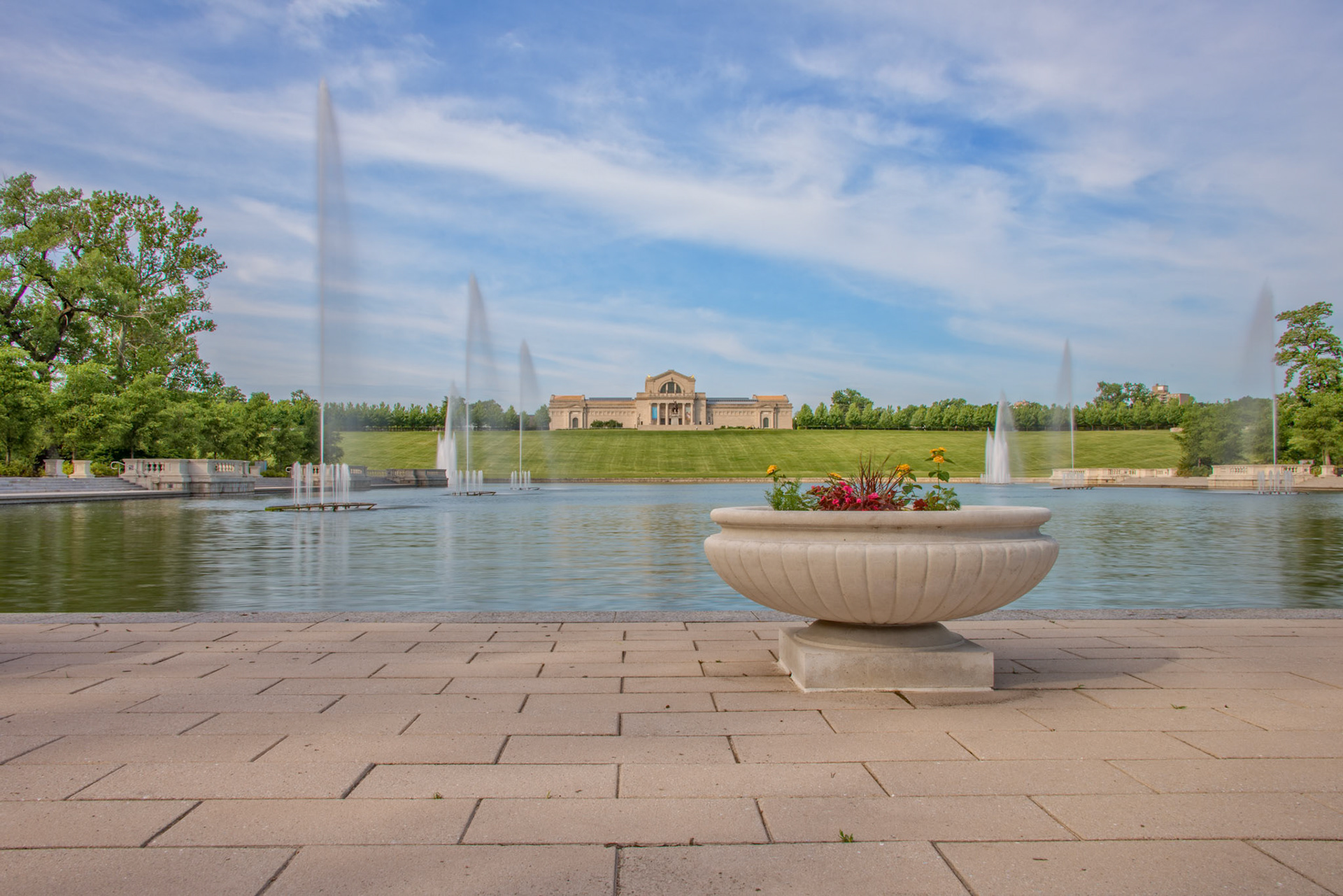 The St Louis Art Museum and Art Hill are viewed from the Grand Basin in Forest Park. Centrally located and popular for wedding pictures, picnics, city fairs, events, and more, the area is often thought of as the heart and soul of Forest Park.