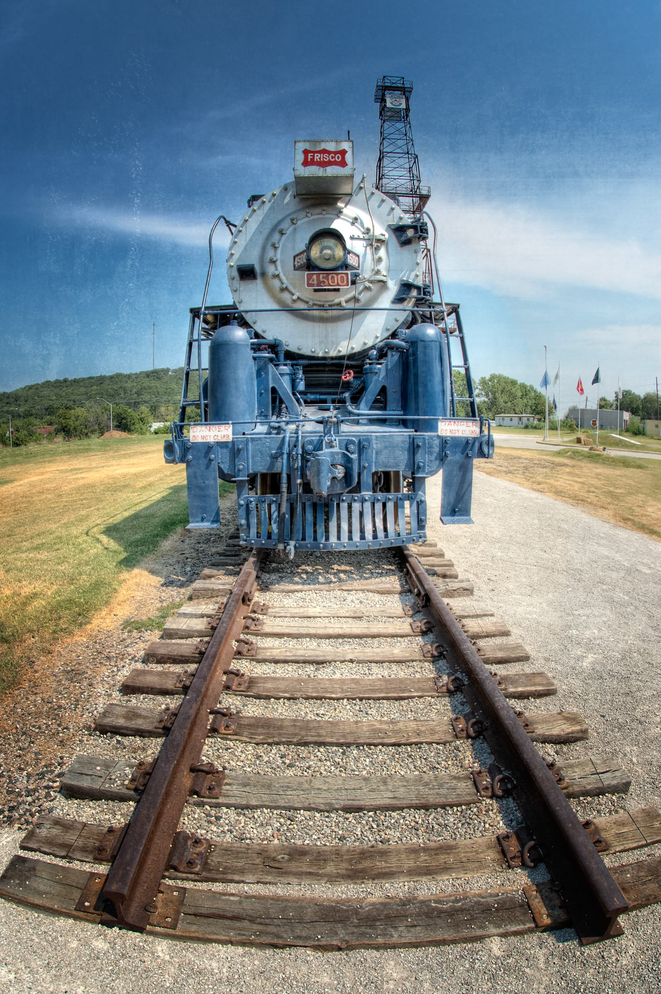 Route 66 Historical Village is an attraction along Old Route 66 in Tulsa, Oklahoma. When visiting in August, 2015, it displayed a restored Frisco 4500 Steam Engine and other restored rail cars, as well as a centennial oil derrick and historic pump jack.