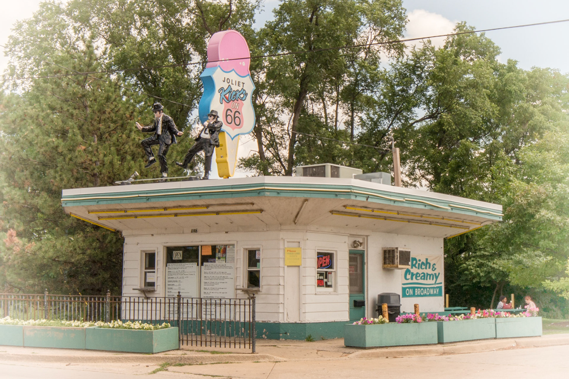Rich and Creamy ice cream stand, a long time favorite of Route 66 travelers. Jake and Elwood Blues dance on its rooftop, a tribute to the historic Joliet Prison, featured in the "The Blues Brothers" movie. Creamy ice cream stand, a long time favorite of Route 66 travelers. Jake and Elwood Blues dance on its rooftop, a tribute to the historic Joliet Prison, featured in the "The Blues Brothers" movie. Creamy ice cream stand, a long time favorite of Route 66 travelers. Jake and Elwood Blues dance on its rooftop, a tribute to the historic Joliet Prison, featured in the "The Blues Brothers" movie.