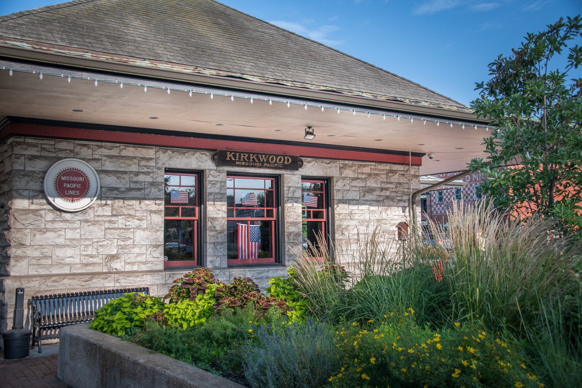 The Kirkwood Train Station is an example of Richardsonian architecture and was constructed by Douglass Donovan to replace a previous wooden station. The track for the Pacific Railroad to Kirkwood was completed in 1853. The first train arrived May 11, 1853, for an auction sale of lots, making Kirkwood the first planned suburb west of the Mississippi. The town was named for the chief engineer for the railroad, James P. Kirkwood. Commuter trains ran to and through Kirkwood until 1961. It is still an active station for Amtrak service and also serves as a visitors center.