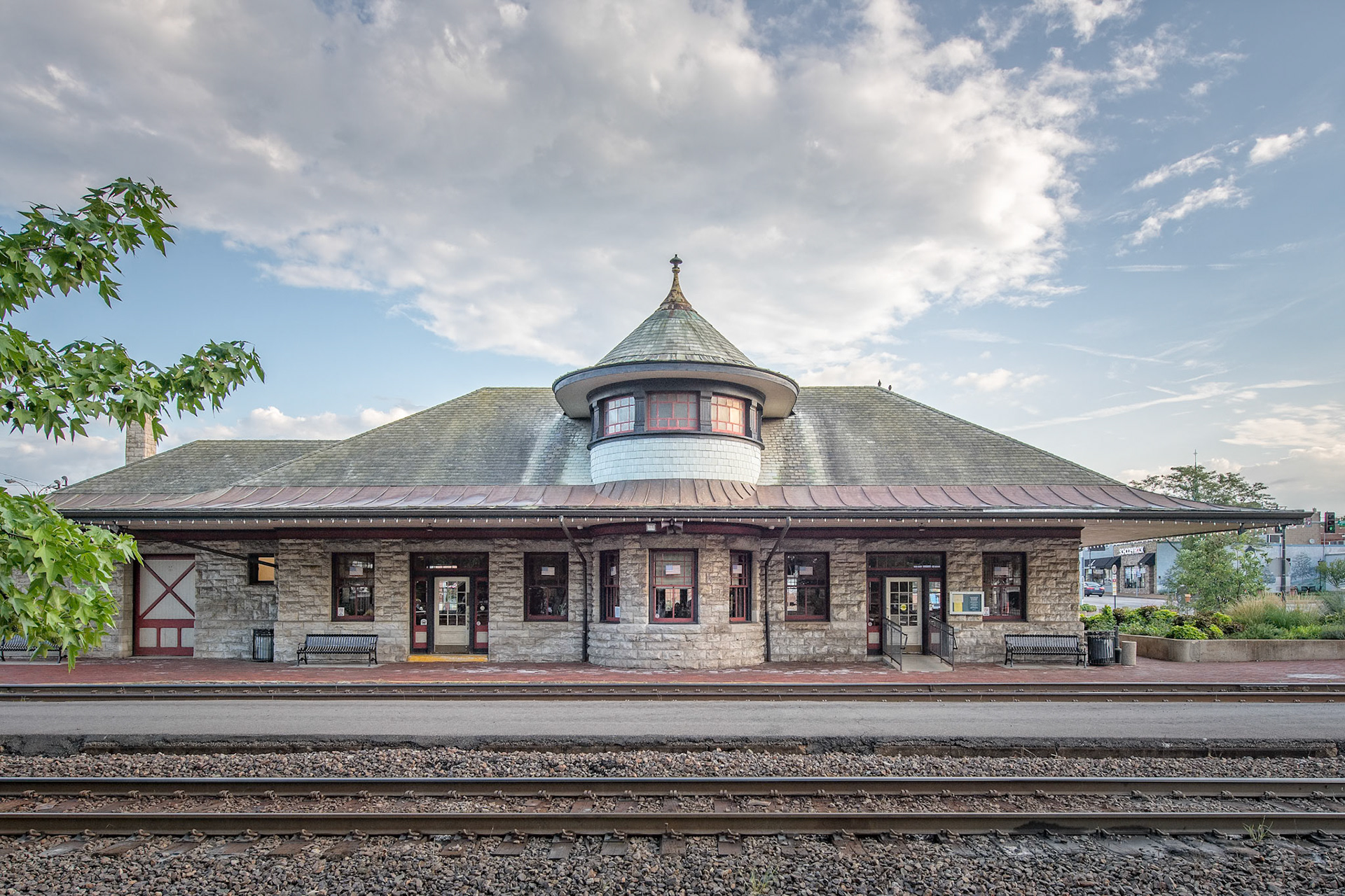 The Kirkwood Train Station is an example of Richardsonian architecture and was constructed by Douglass Donovan to replace a previous wooden station. The track for the Pacific Railroad to Kirkwood was completed in 1853. The first train arrived May 11, 1853, for an auction sale of lots, making Kirkwood the first planned suburb west of the Mississippi. The town was named for the chief engineer for the railroad, James P. Kirkwood. Commuter trains ran to and through Kirkwood until 1961. It is still an active station for Amtrak service and also serves as a visitors center.
