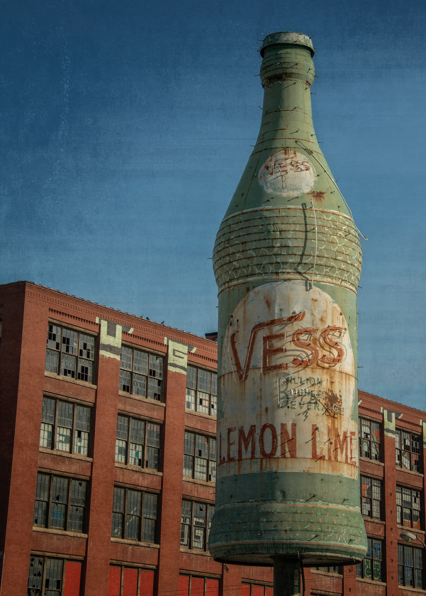 Columbus Square is an area just north of downtown St. Louis.  Remnants of a bygone industrial era remain in a few abandoned warehouses. A vintage Vess soda bottle also greets visitors to the city as they approach from the north on I-70.