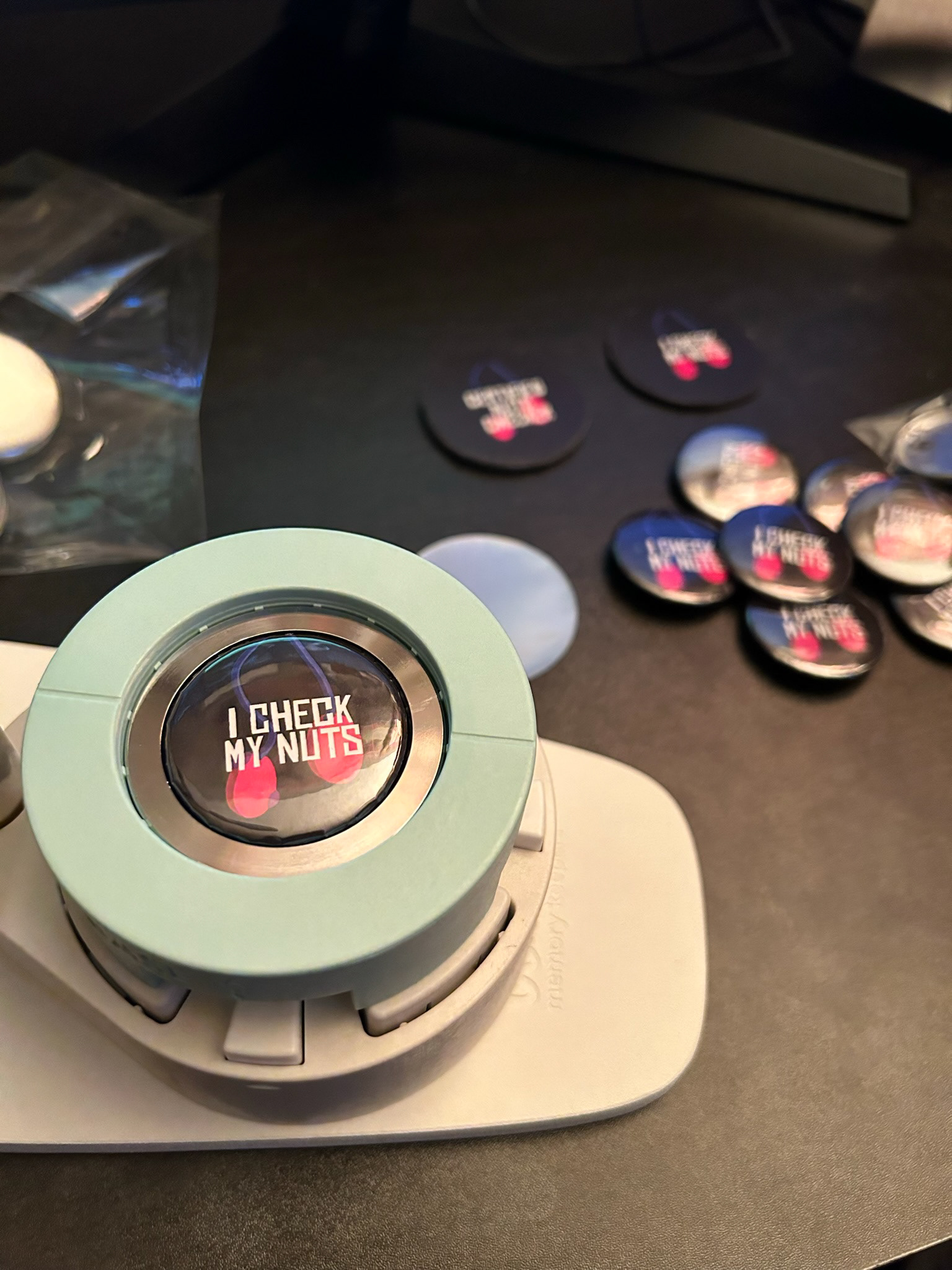 Hand-pressed free buttons from the campaign promo at GradEx 108