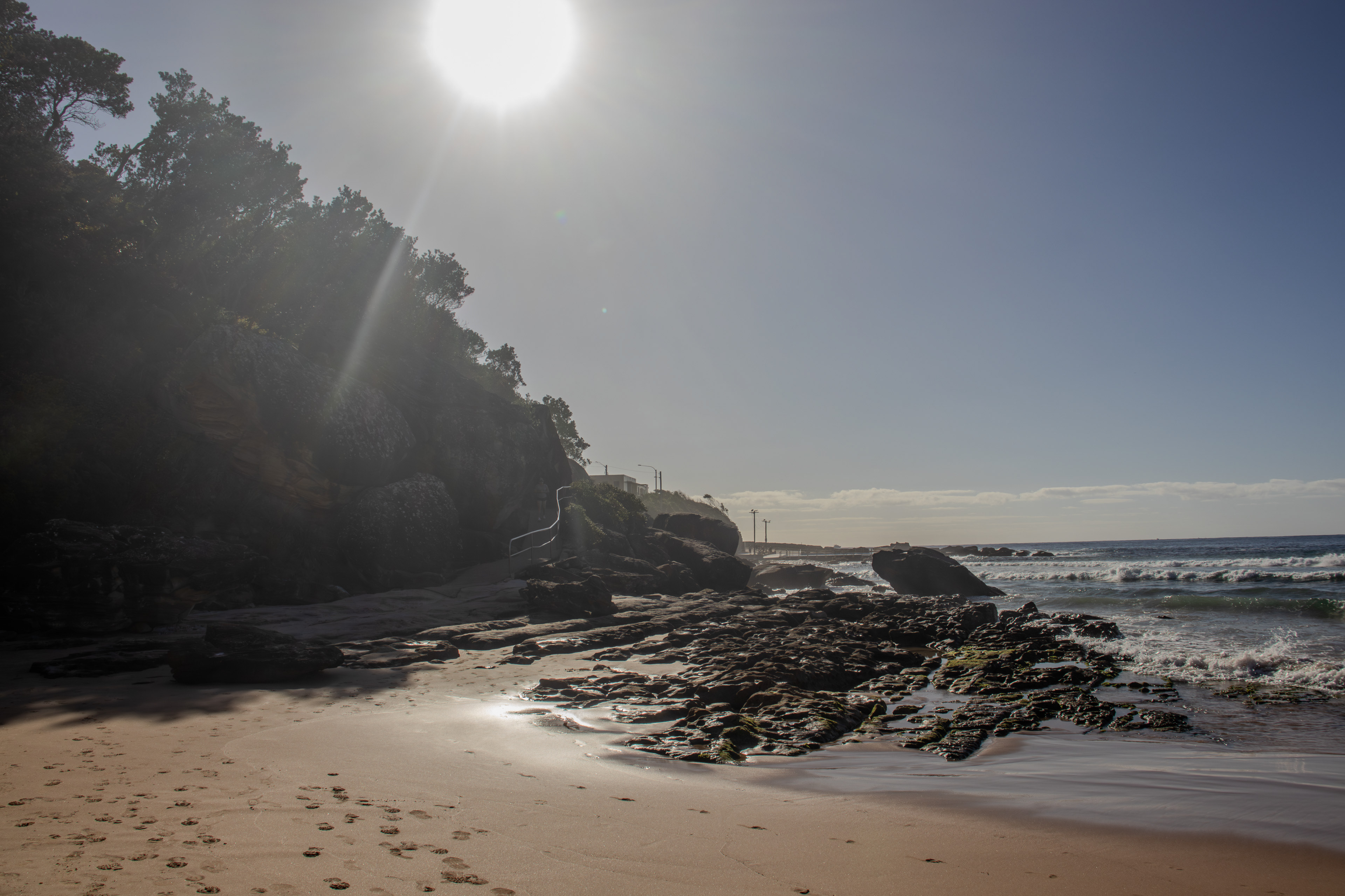 Rocks along the rockpool side of a beach