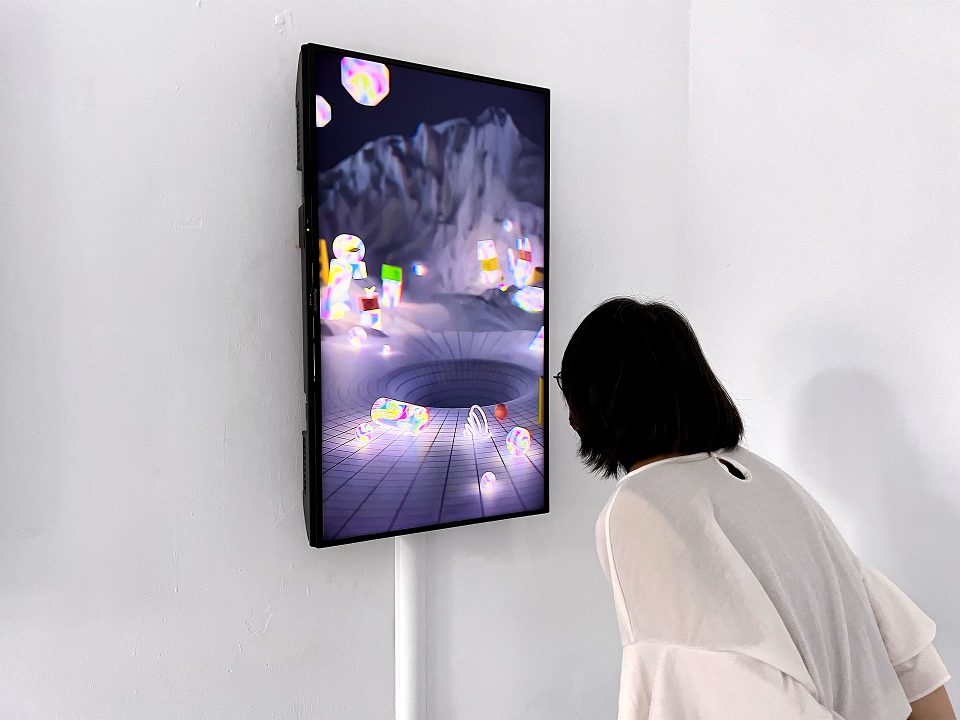 Sound is output via speakers below the screen for hearing