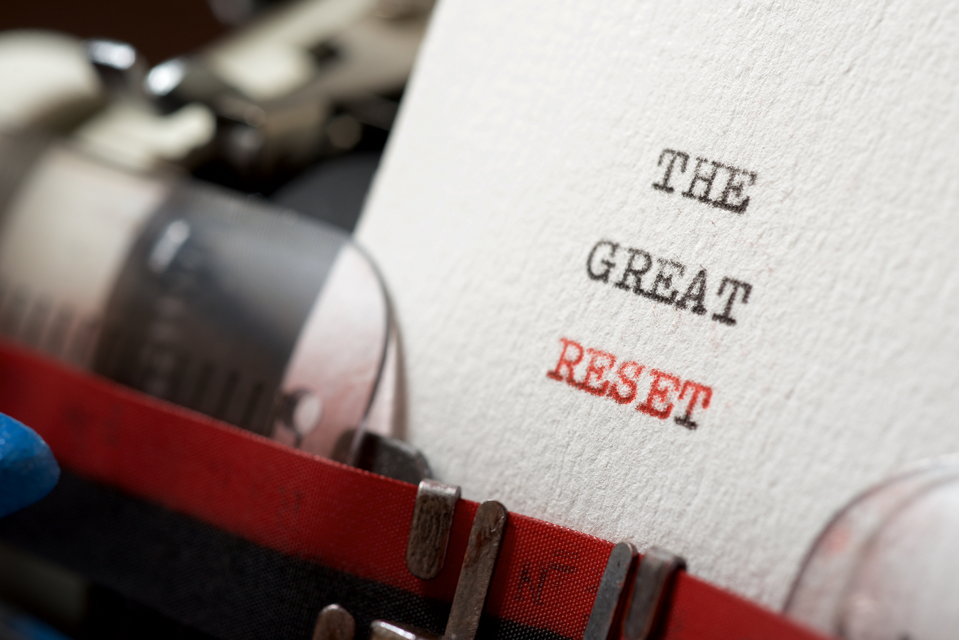 The words ‘The Great Reset’ typed on paper in a vintage typewriter