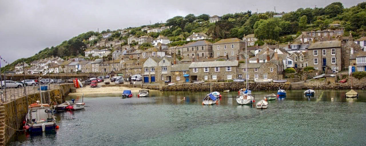 Mousehole is a nice quiet village in the county of Cornwall, here you can see a wide view of the harbour in summer time.