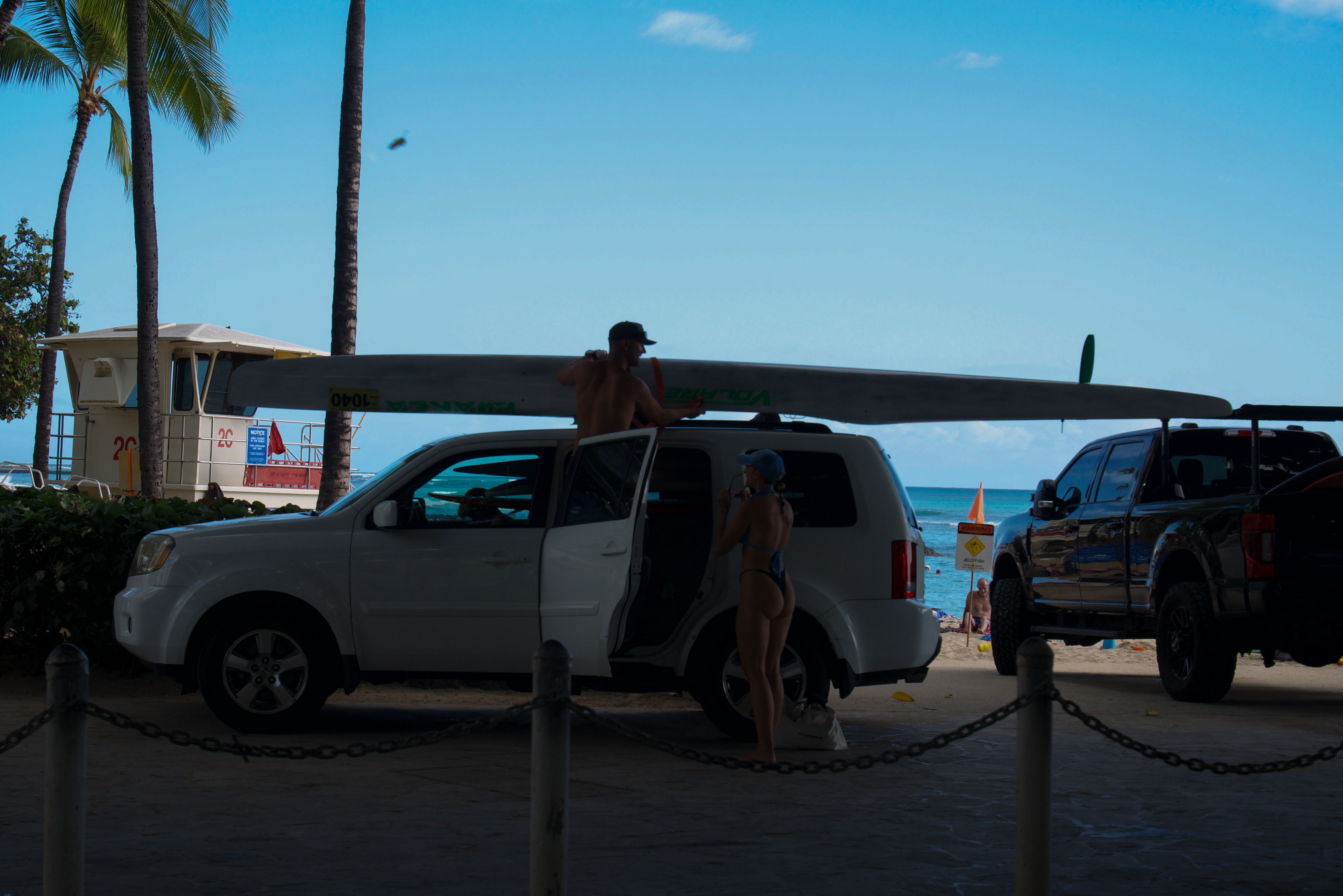 I can see a surfer.