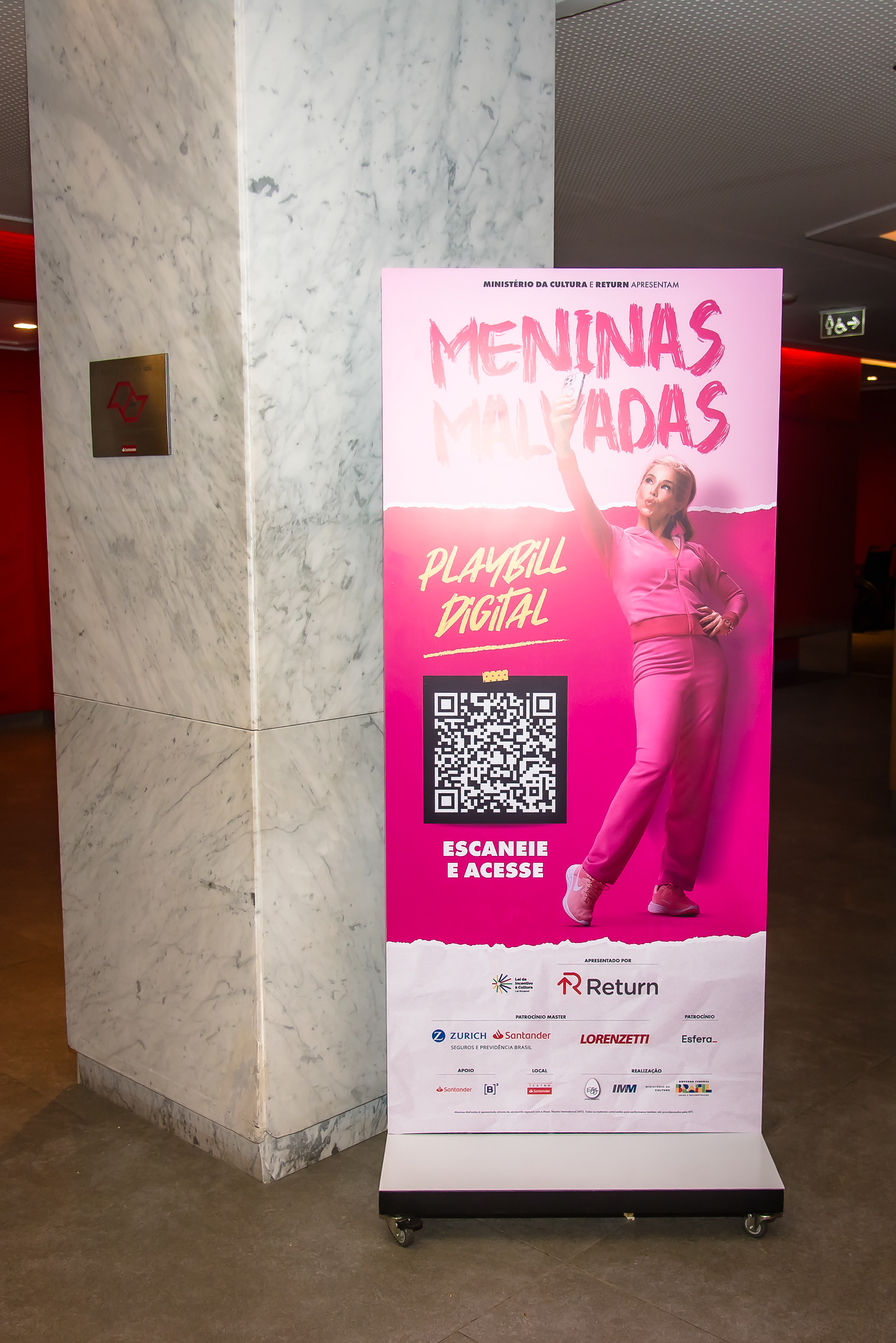 Info totem for the audience to access the digital playbill via QR code.