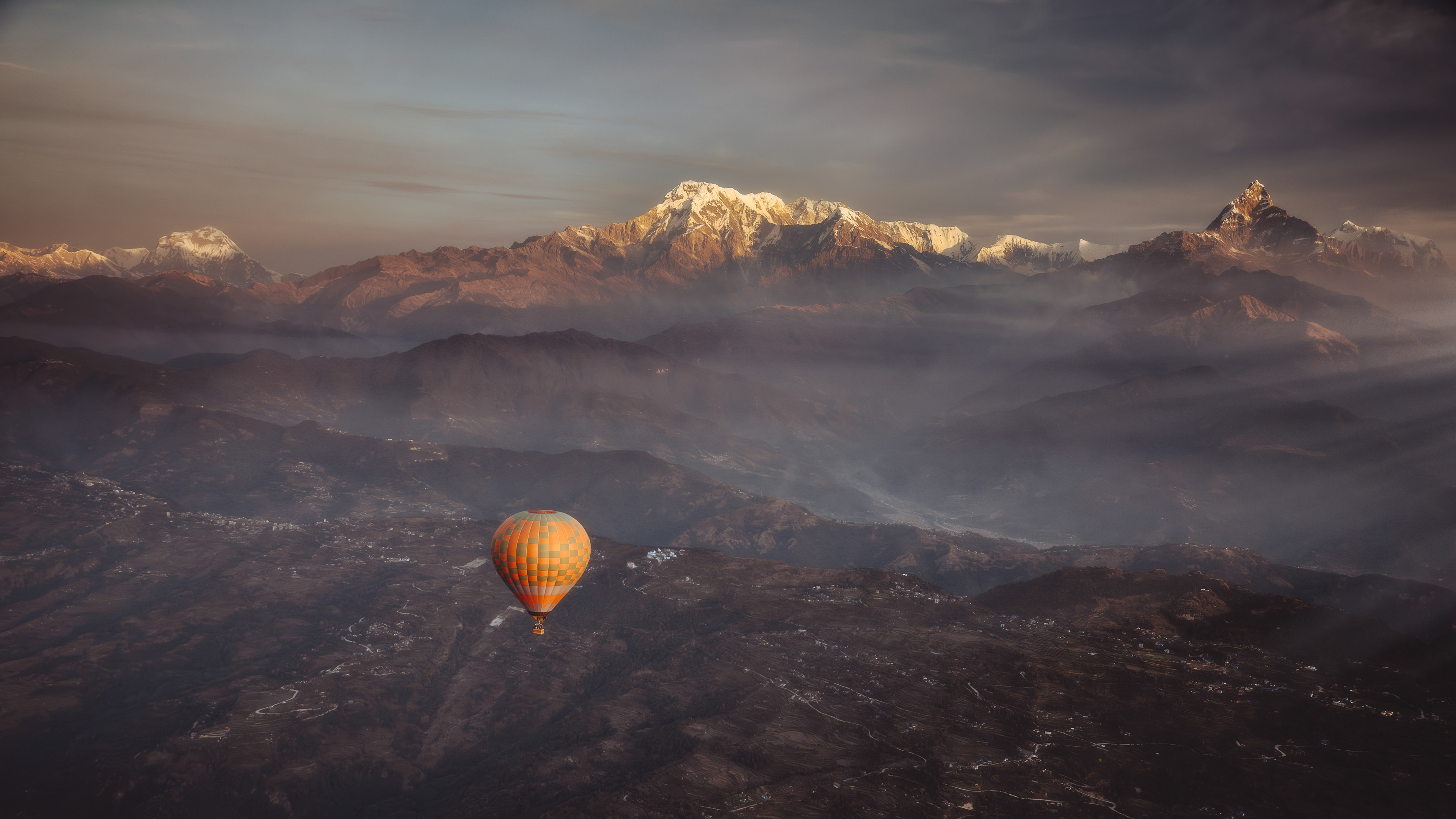 Above the valleys, beneath the giants.