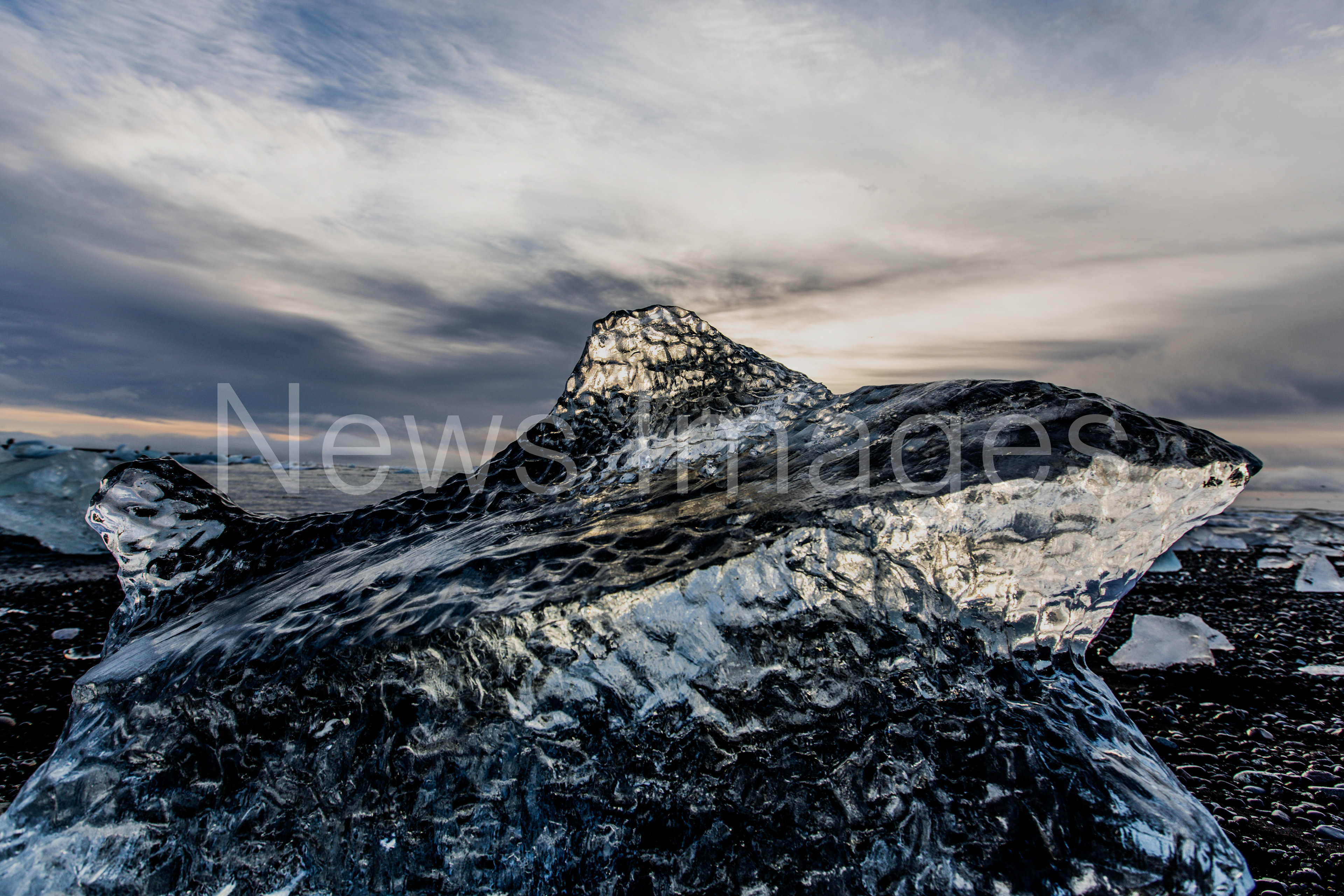 A small shark shaped iceberg washed up on 'Diamond Beach' in Iceland