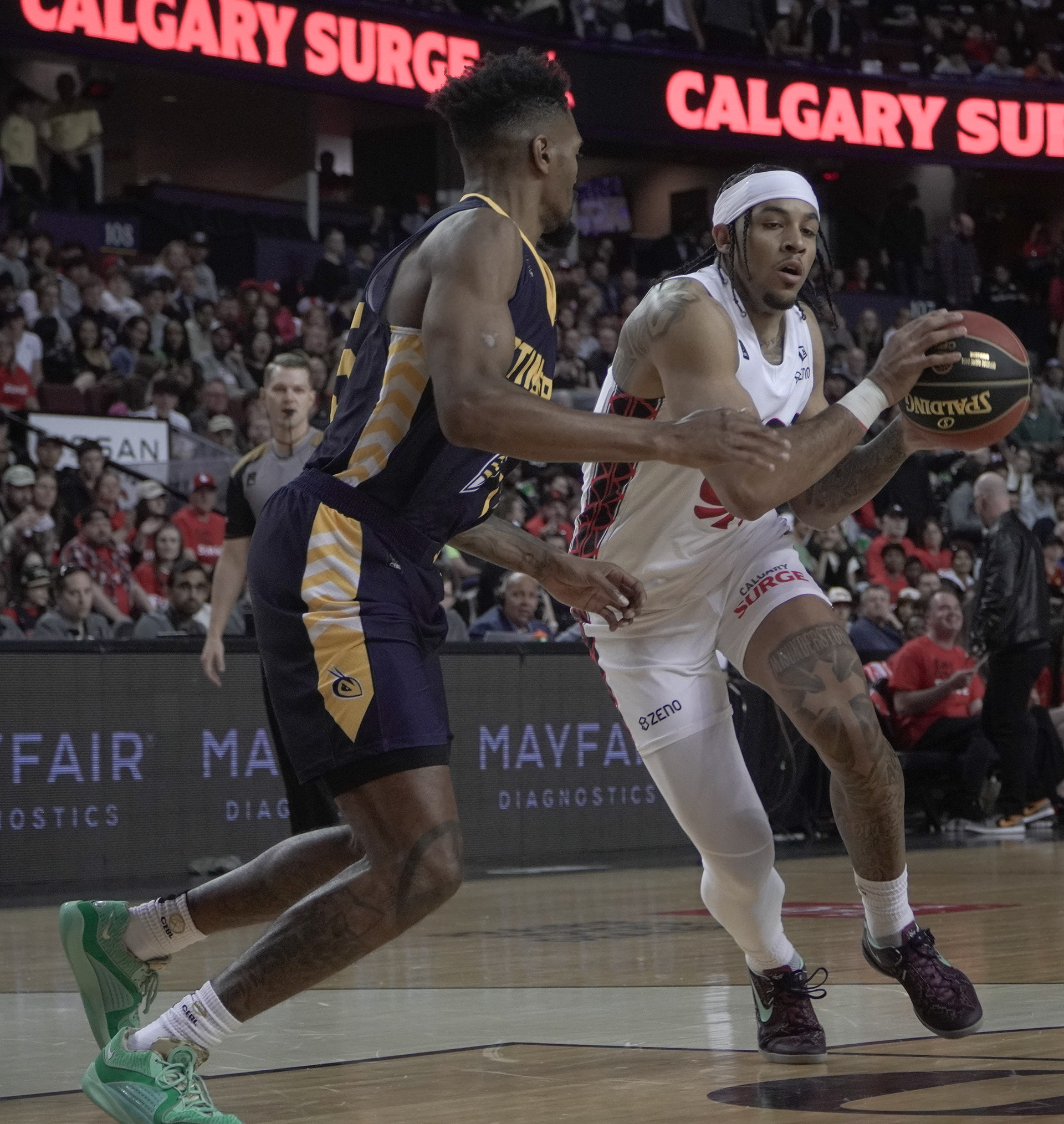 Surge guard Sean (Rugzy) Miller-Moore drives against Jacob Evans III on May 21, 2024. Rugzy finished the game with a game-high eight turnovers. (Photo by Josiah Navratil/The Press)