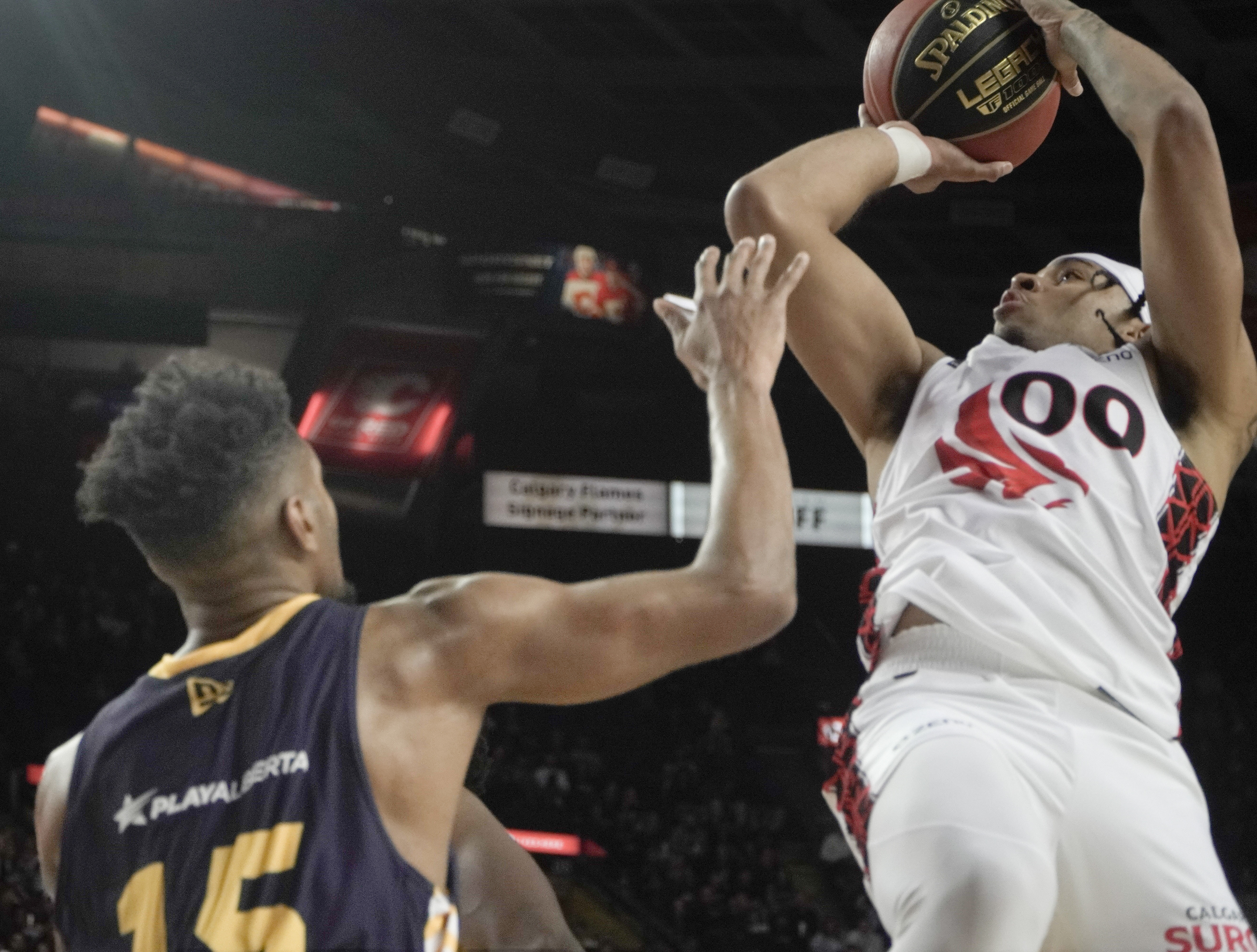 Surge guard Sean (Rugzy) Miller-Moore shoots over Stinger guard Jacob Evans III on May 21, 2024. (Photo by Josiah Navratil/The Press)