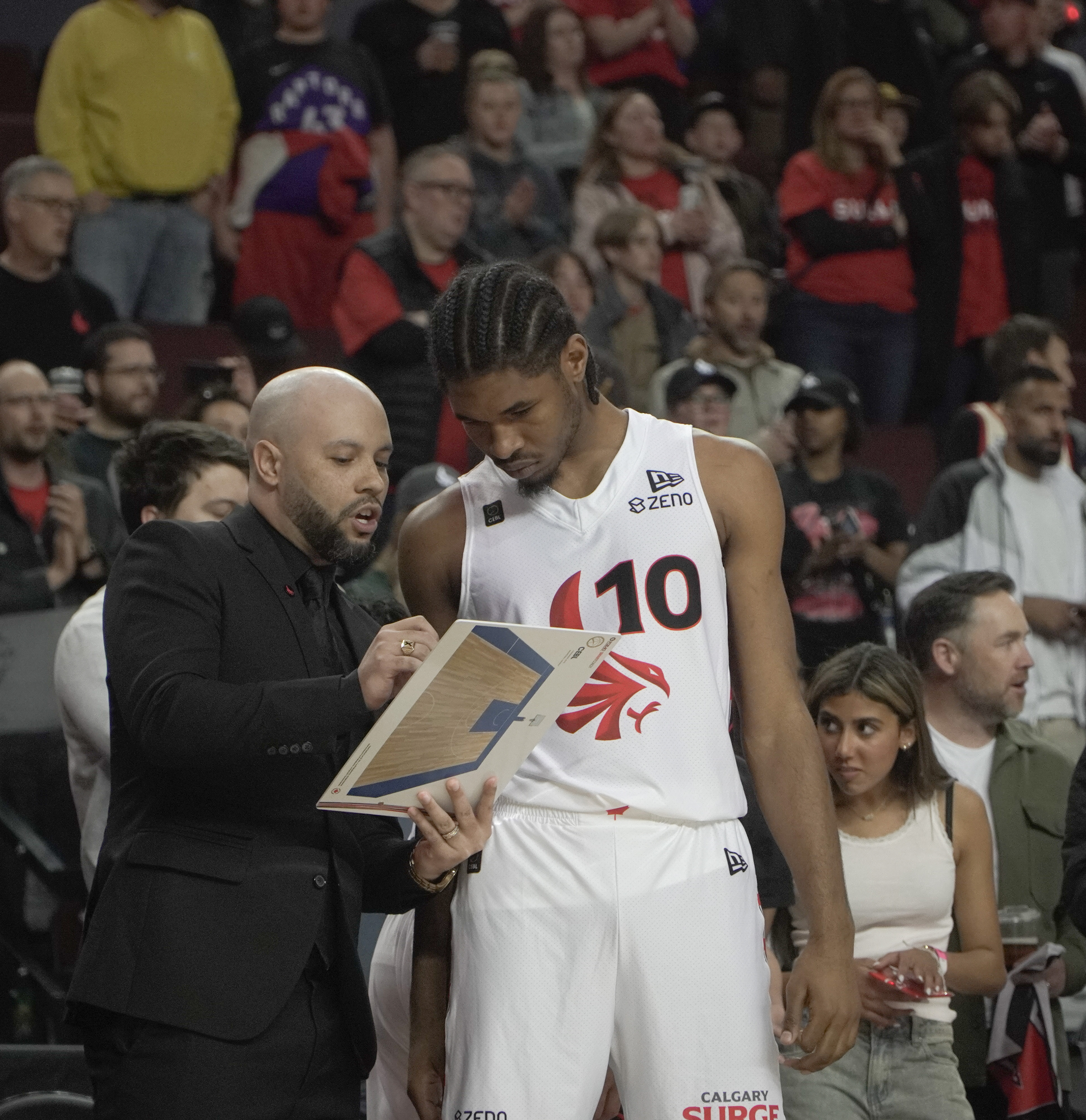 Surge forward Justin Lewis watches as head coach Tyrell Vernon draws up a play on May 21, 2024.. (Photo by Josiah Navratil/The Press)