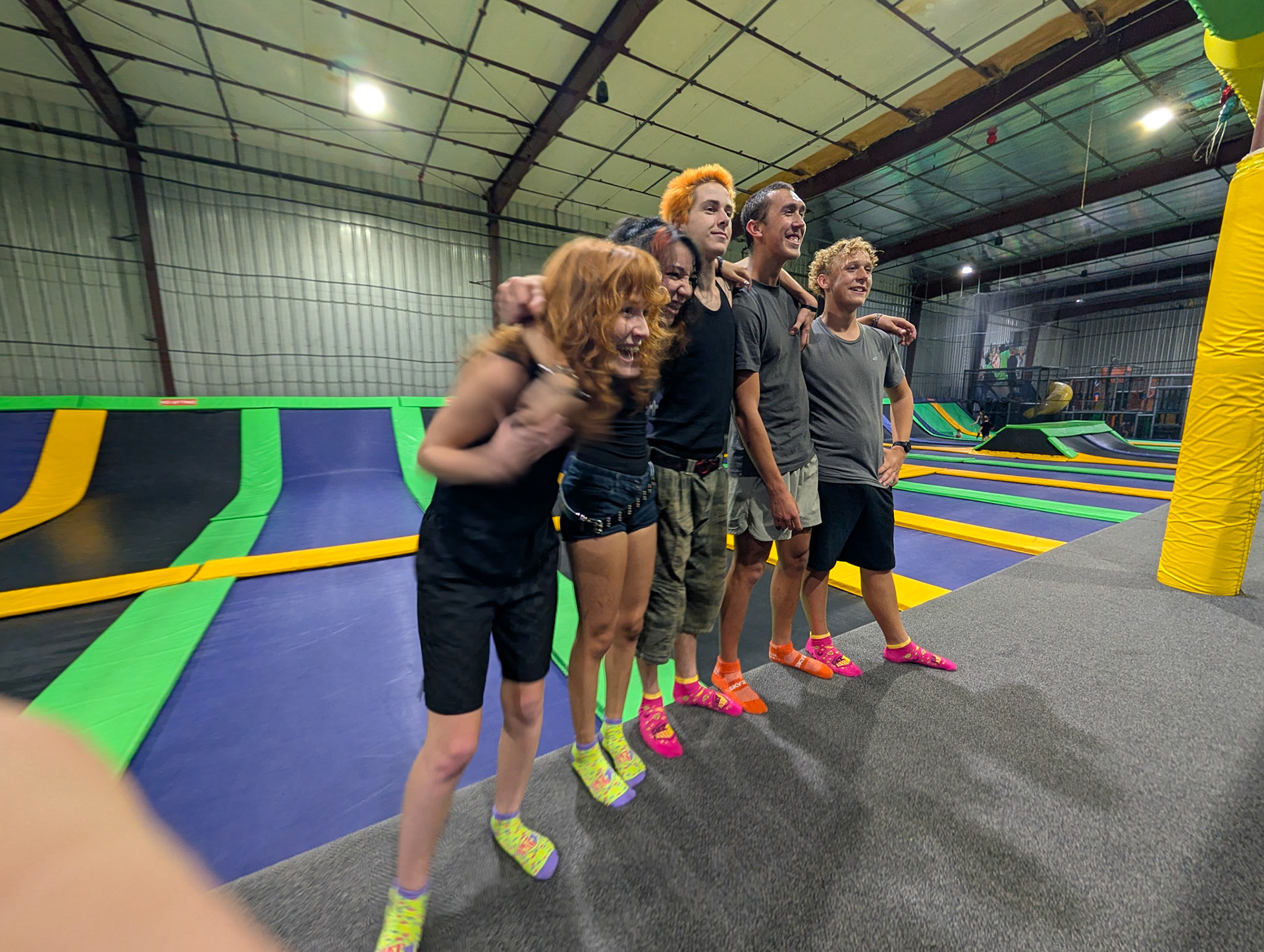 The kids lined up in front of the trampoline's at Jaiden's birthday party