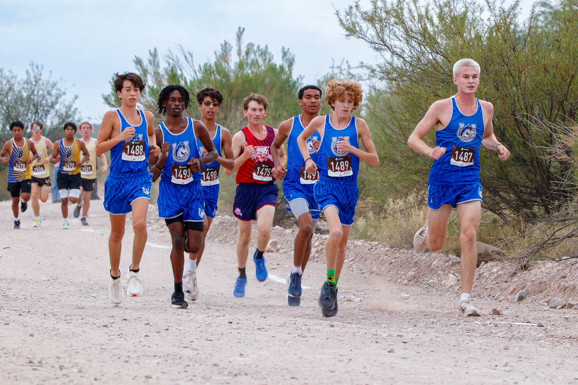 Varsity running together at the start of the race
