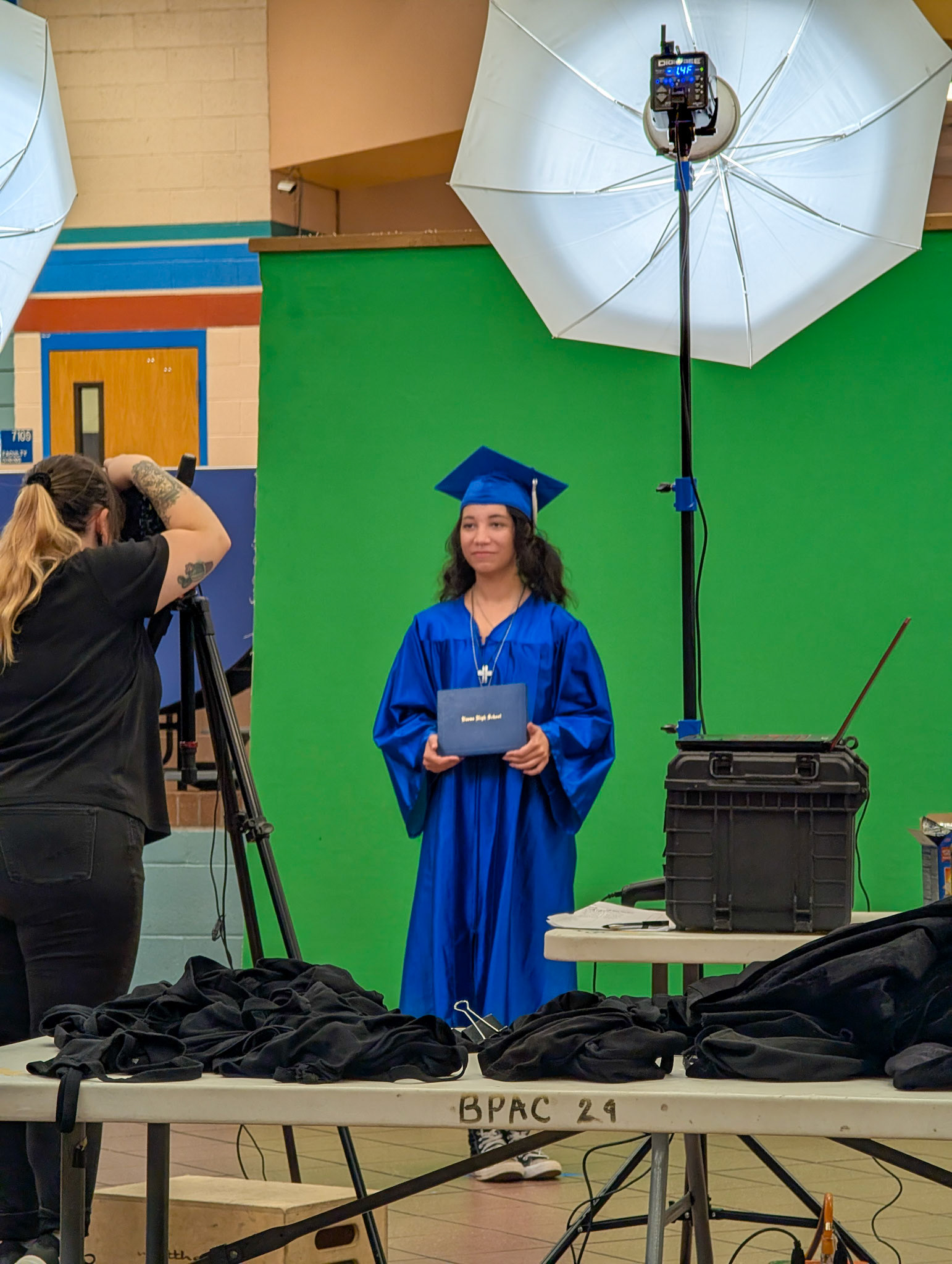 Take the yearbook picture in her cap and gown