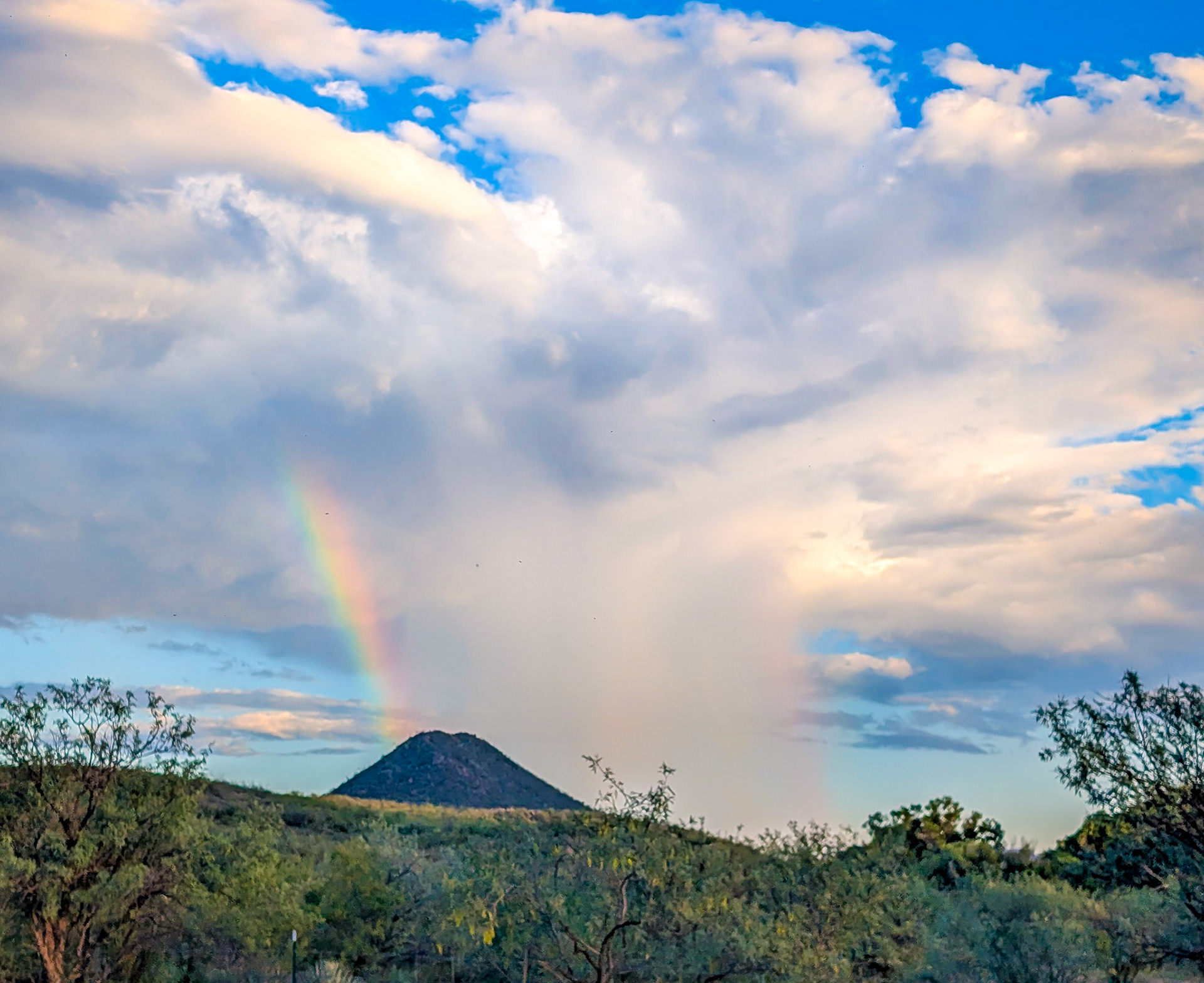 Didn't even expect rain this day, let alone a cool rainbow