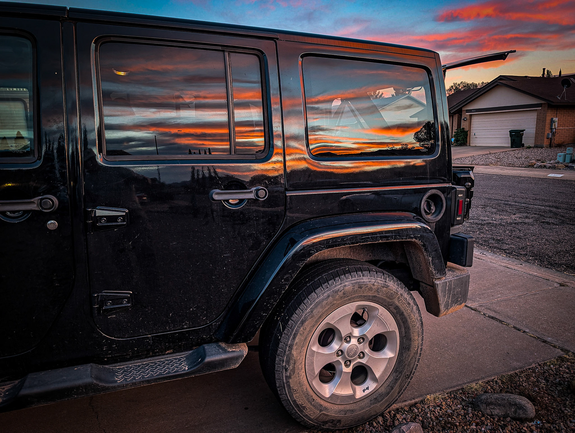 Sunset reflecting in the Jeep window