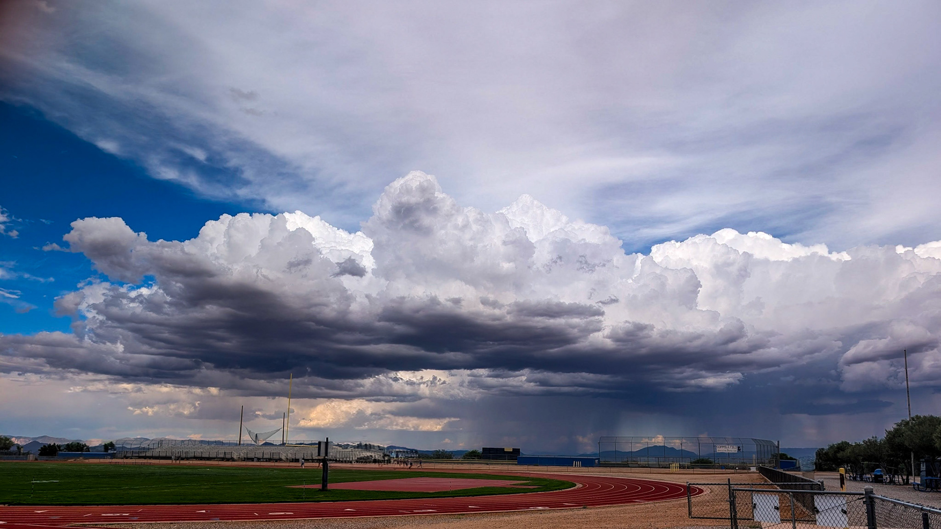 Rain showers in the distance threated the track meet