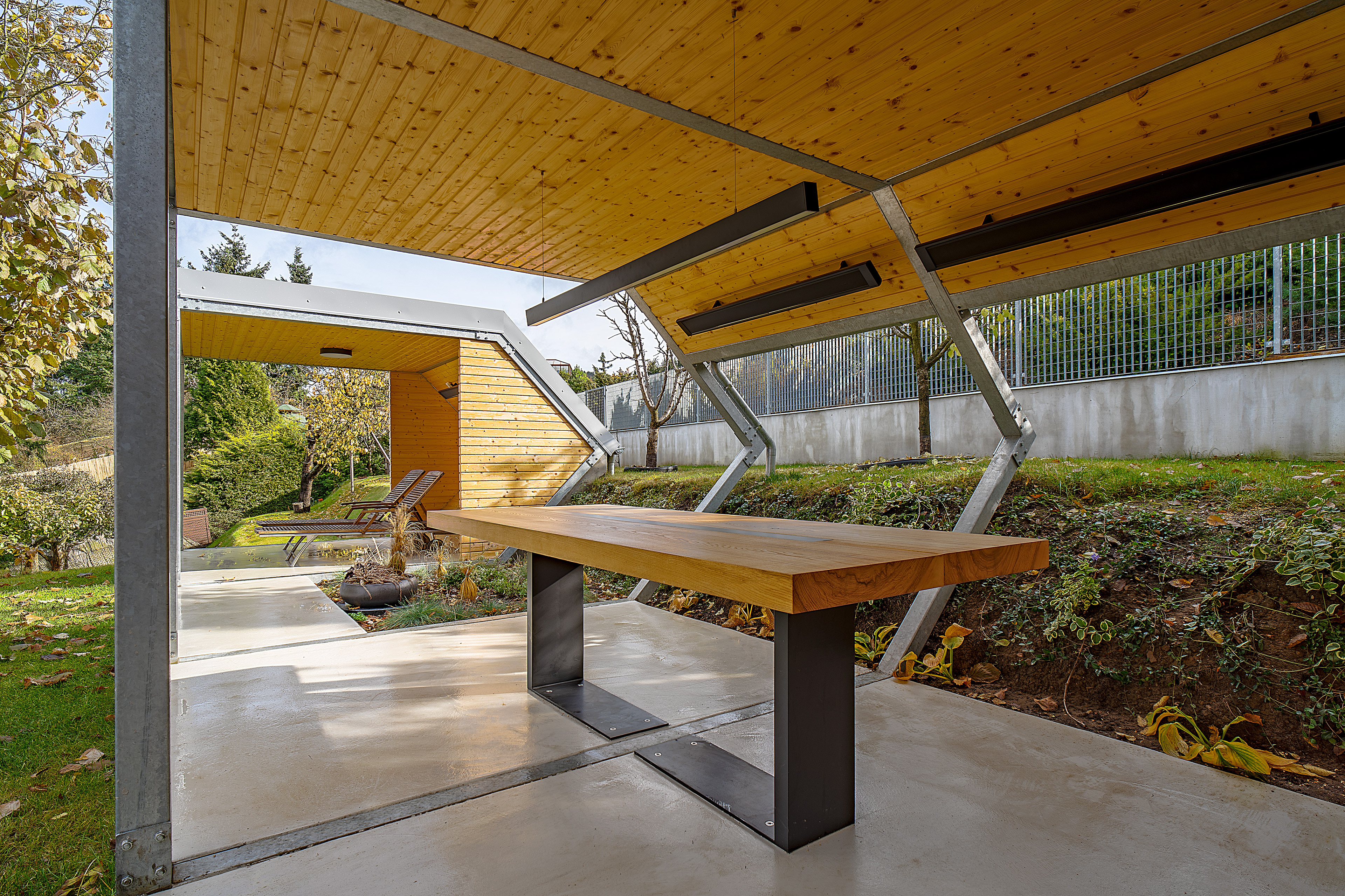 Custom garden table designed for a terrace, with visible wood grain and clean lines