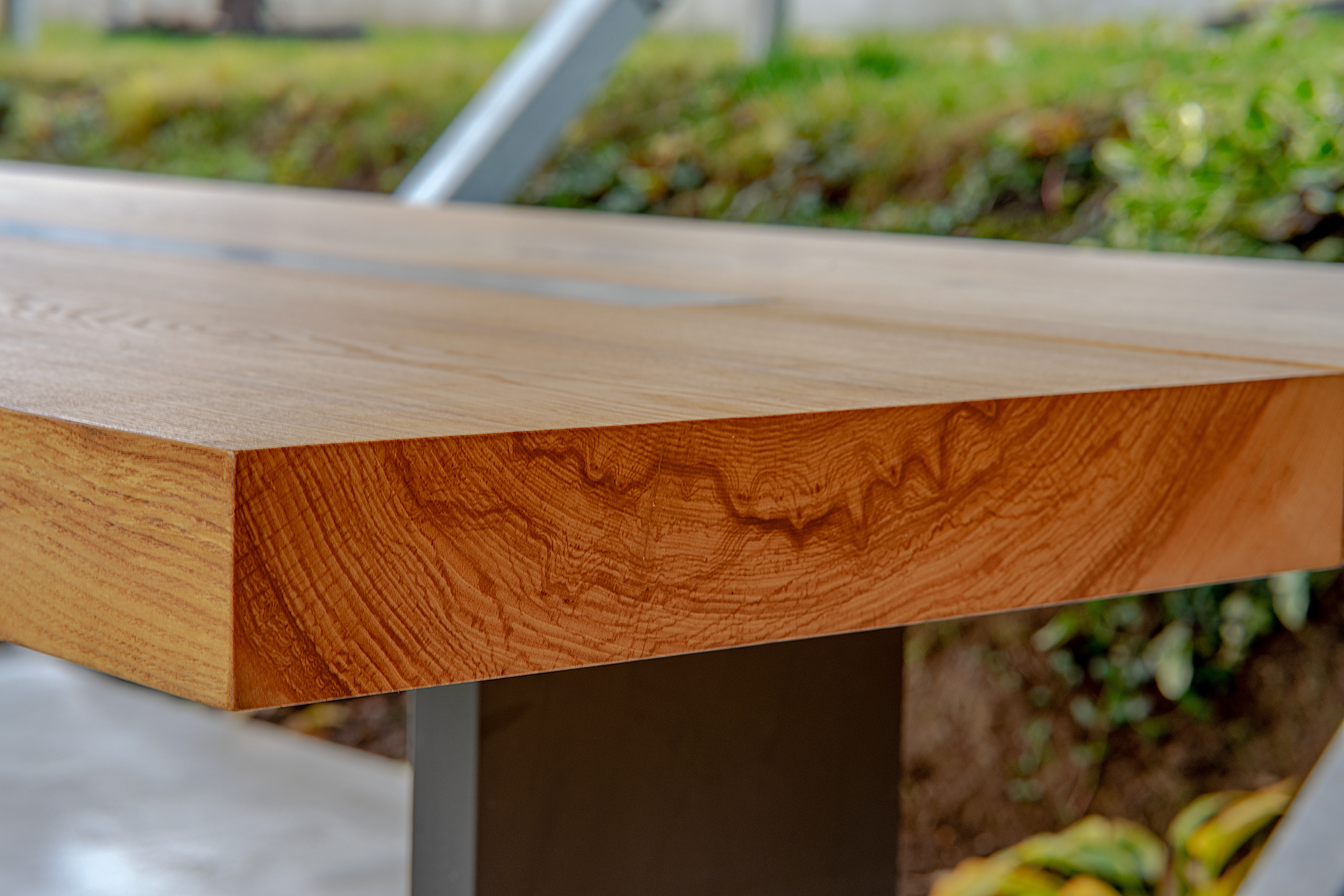 Custom garden table designed for a terrace, with visible wood grain and clean lines