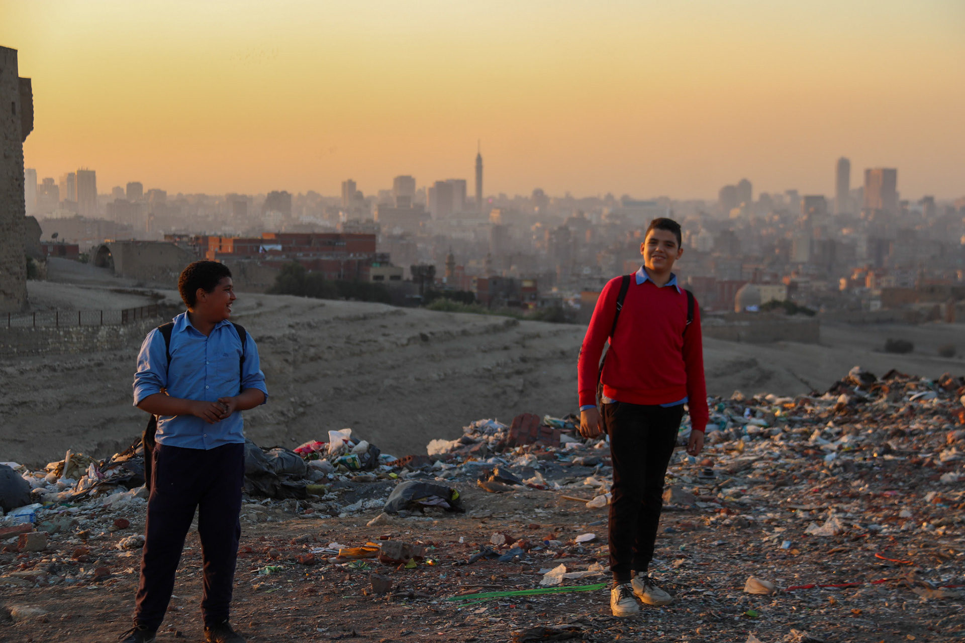 Charming boys returning to "The Garbage City" after school