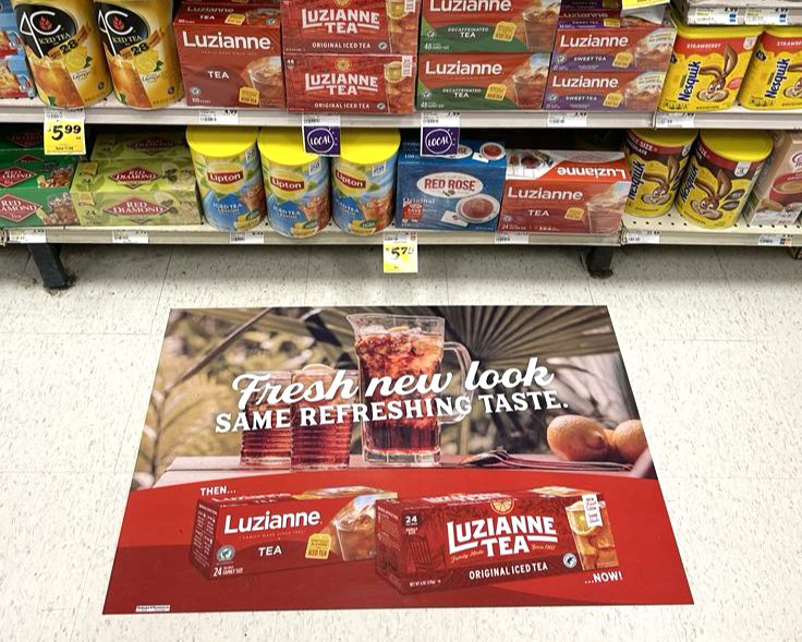 Supported packaging design transition with in-store ads.