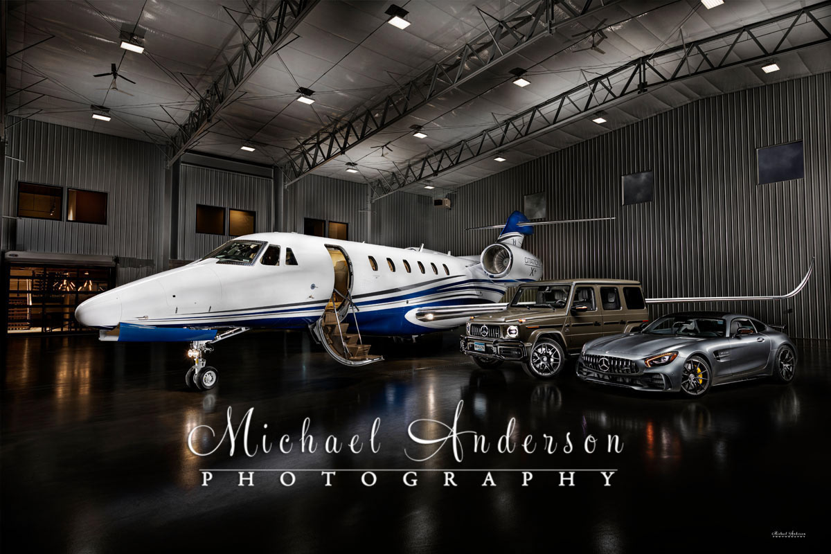 A stunning light painted photograph of a Citation X+, along with a 2020 G63 Mercedes Benz, and a 2020 Mercedes Benz GTR.