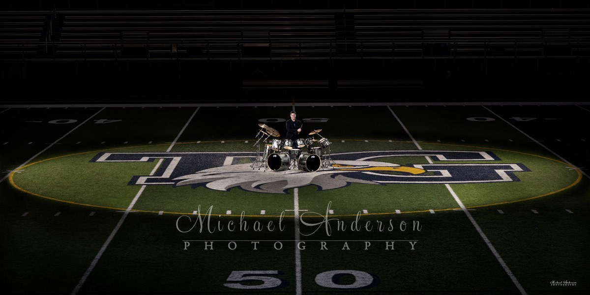 Nate's cool light painted senior portrait with his drums. The photo was created on the 50-yard line at Totino-Grace High School in Fridley, MN.
