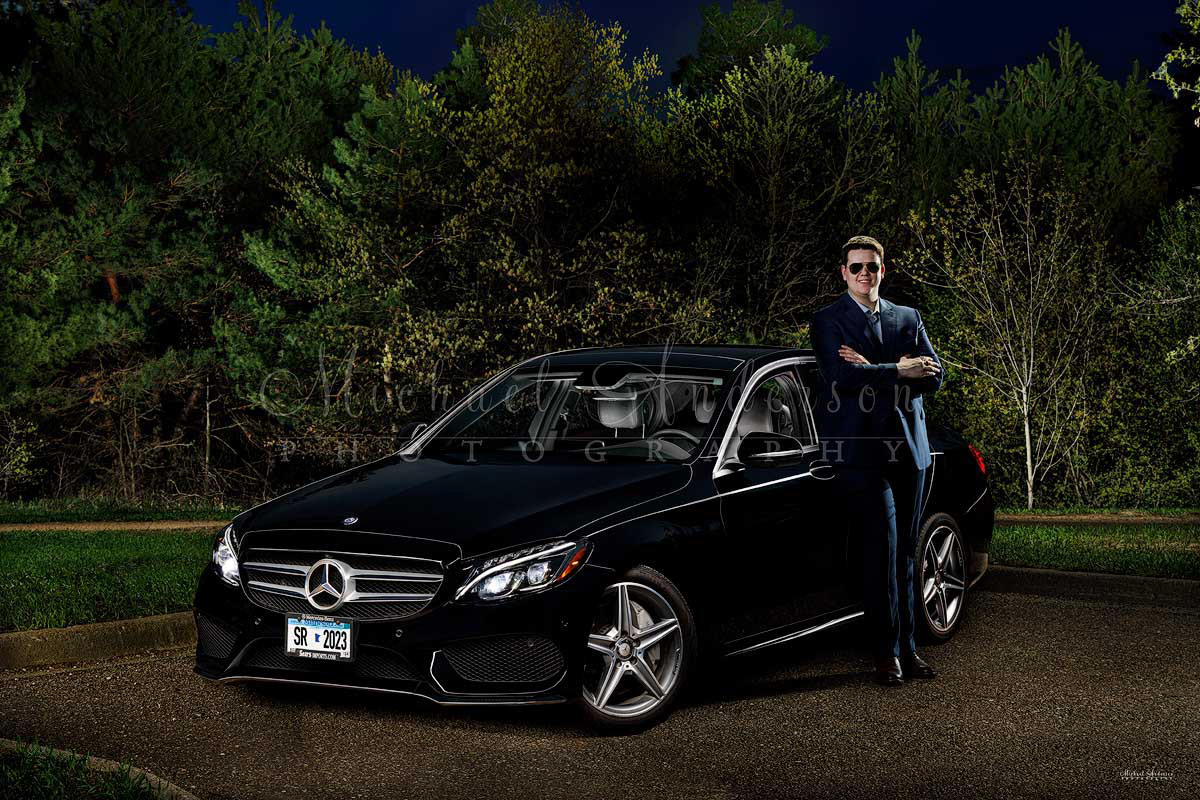 A painted photograph of a black 2016 Mercedes Benz C300. This image was created as a senior portrait with a 2023 graduate from Totino Grace High School in Fridley, Minnesota.