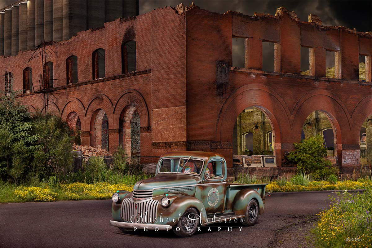 A cool light-painted photograph of a 1941 Chevy AK pickup in front of the burned-out Twohy Mercantile Building in Superior, Wisconsin.