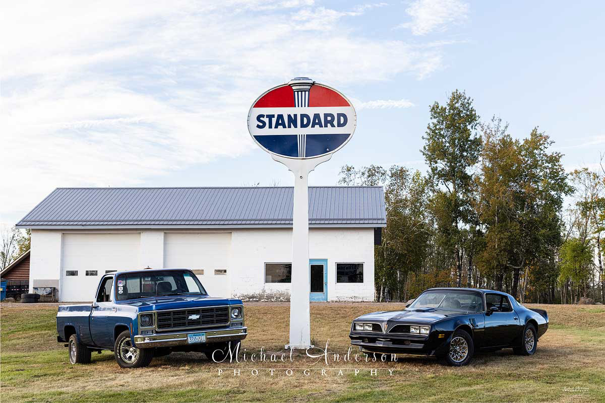 The "before" photo of a 1979 Trans Am and a 1979 Chevy truck in front of an old service station prior to light painting the entire scene.