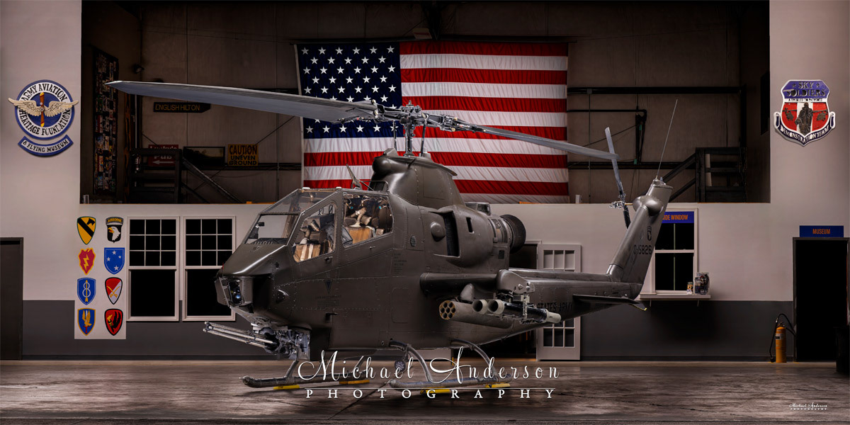 A stunning light painted photograph of AH-1F “Cobra” N826HF created at the Army Aviation Heritage Foundation & Flying Museum in Hampton, Georgia.