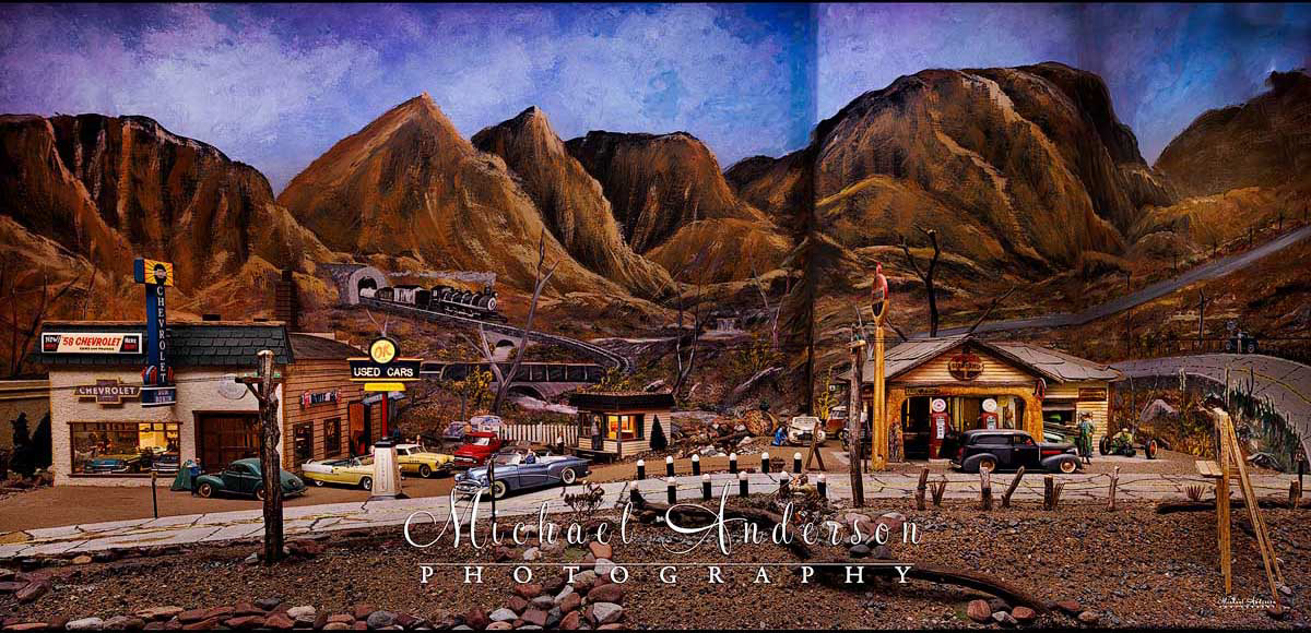 Part of a 3-piece panorama of an amazing Route 66 diorama. In this section there's a Chevrolet dealership and a Standard Gas Station.