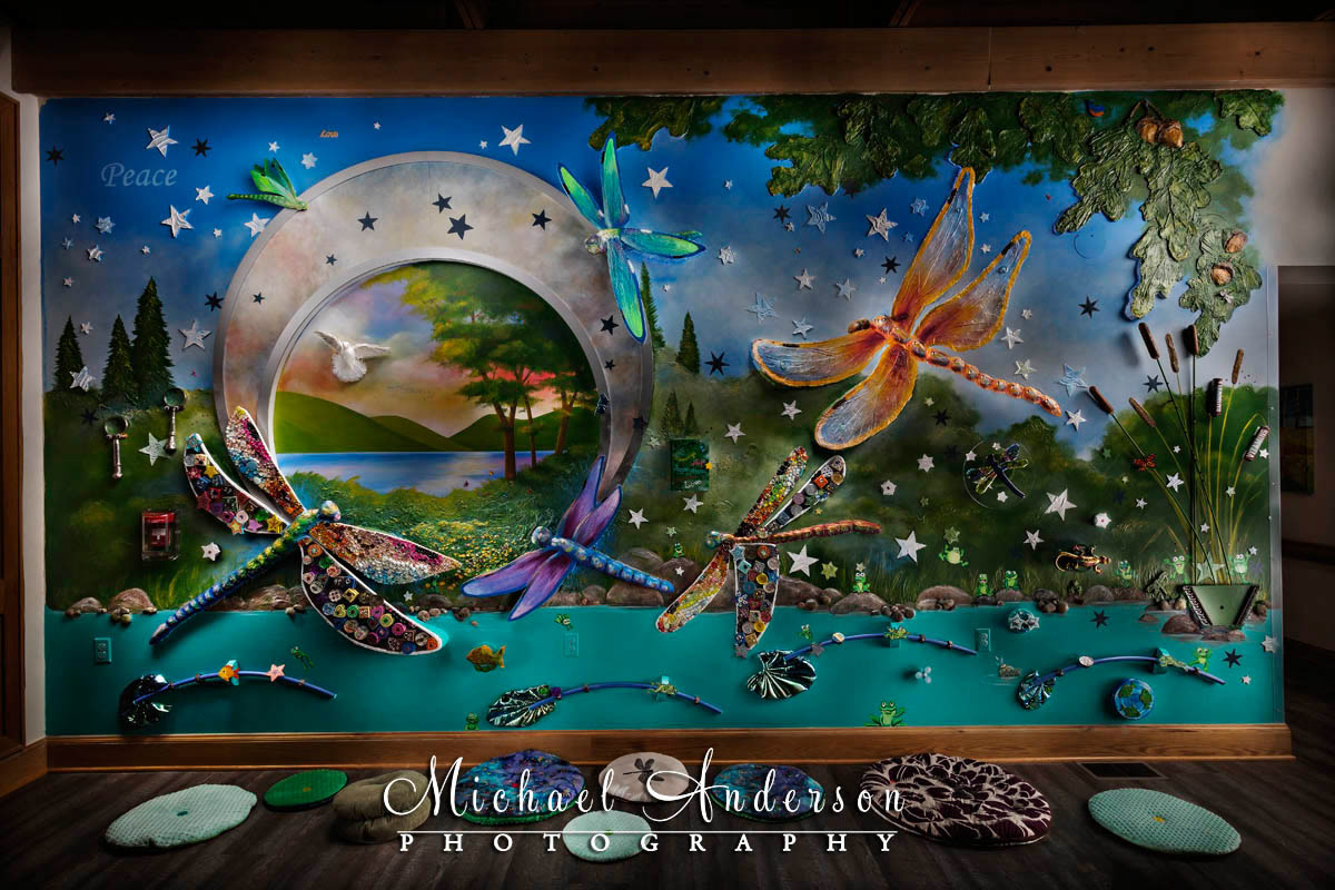 A light painted photograph of the Sensory Art Wall at Crescent Cove in Brooklyn Center, MN.