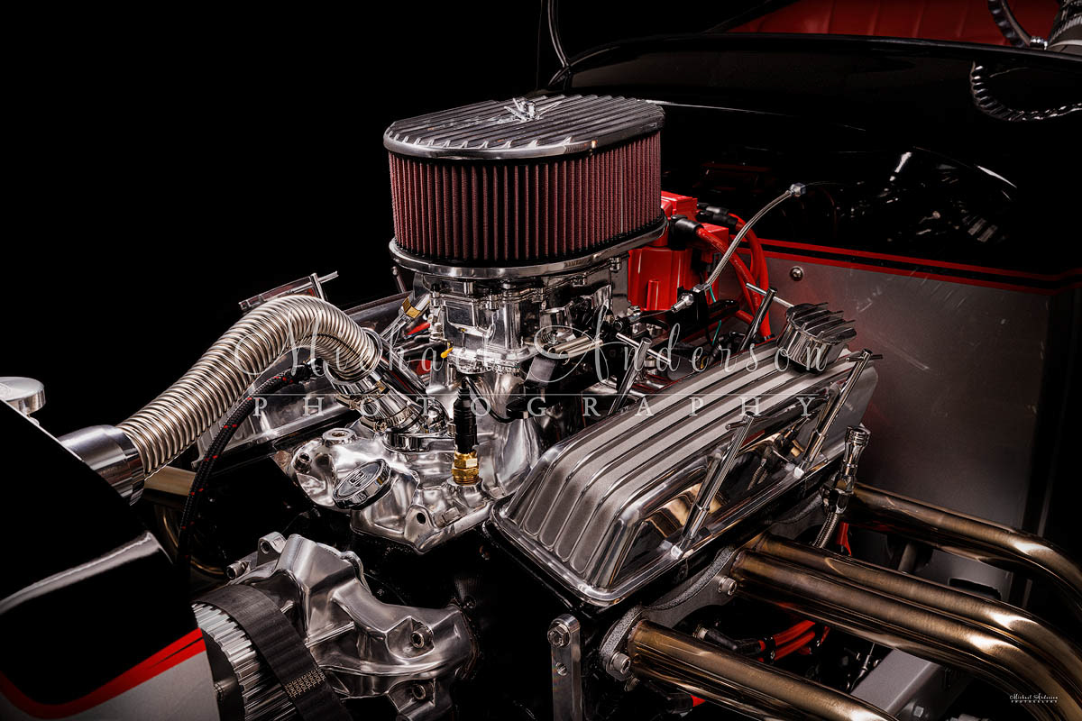 Light painted photograph, side view, of the engine bay of a 1927 Spirit T Roadster.