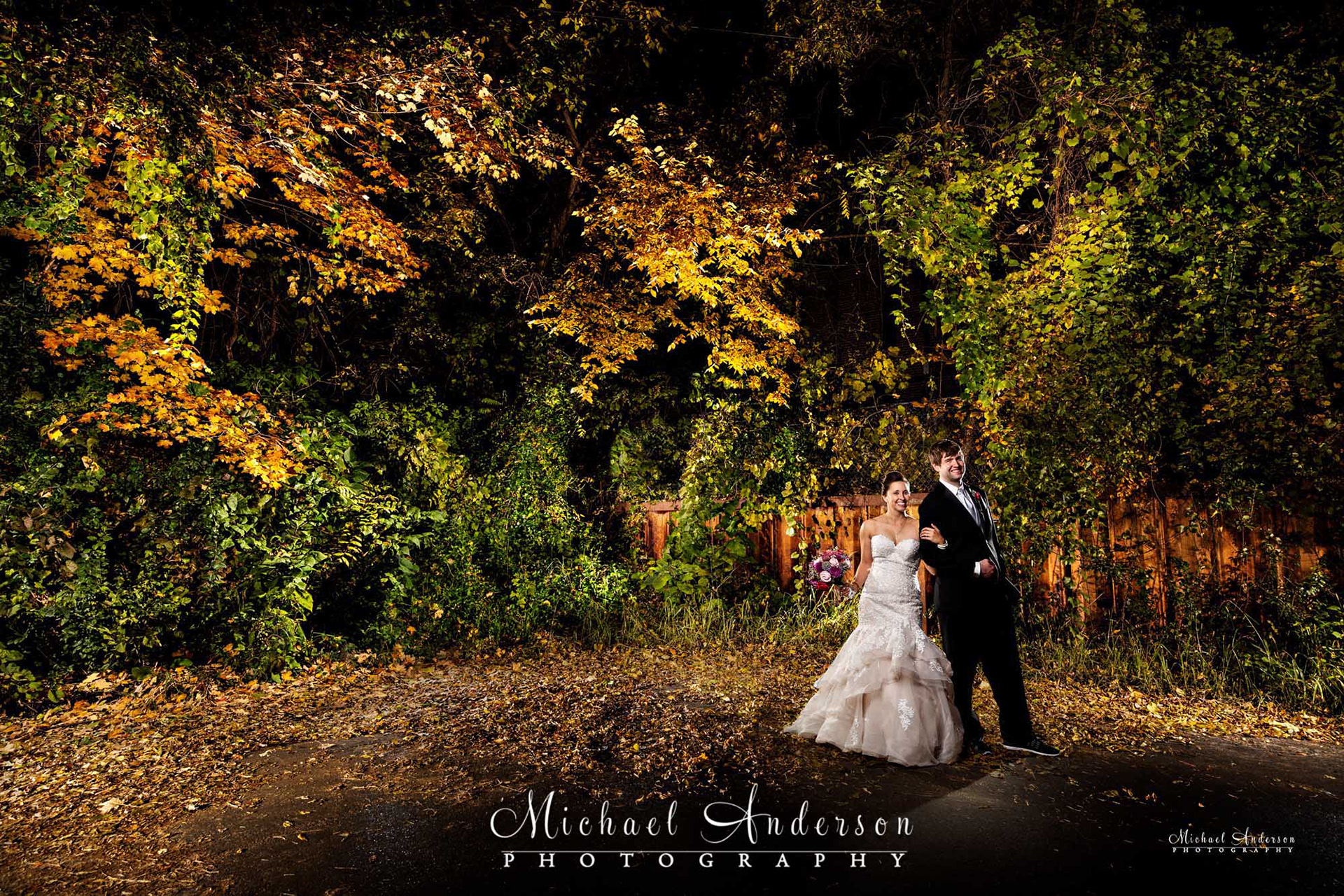 Light painted wedding photograph with pretty fall created in a parking lot in downtown Stillwater, MN.