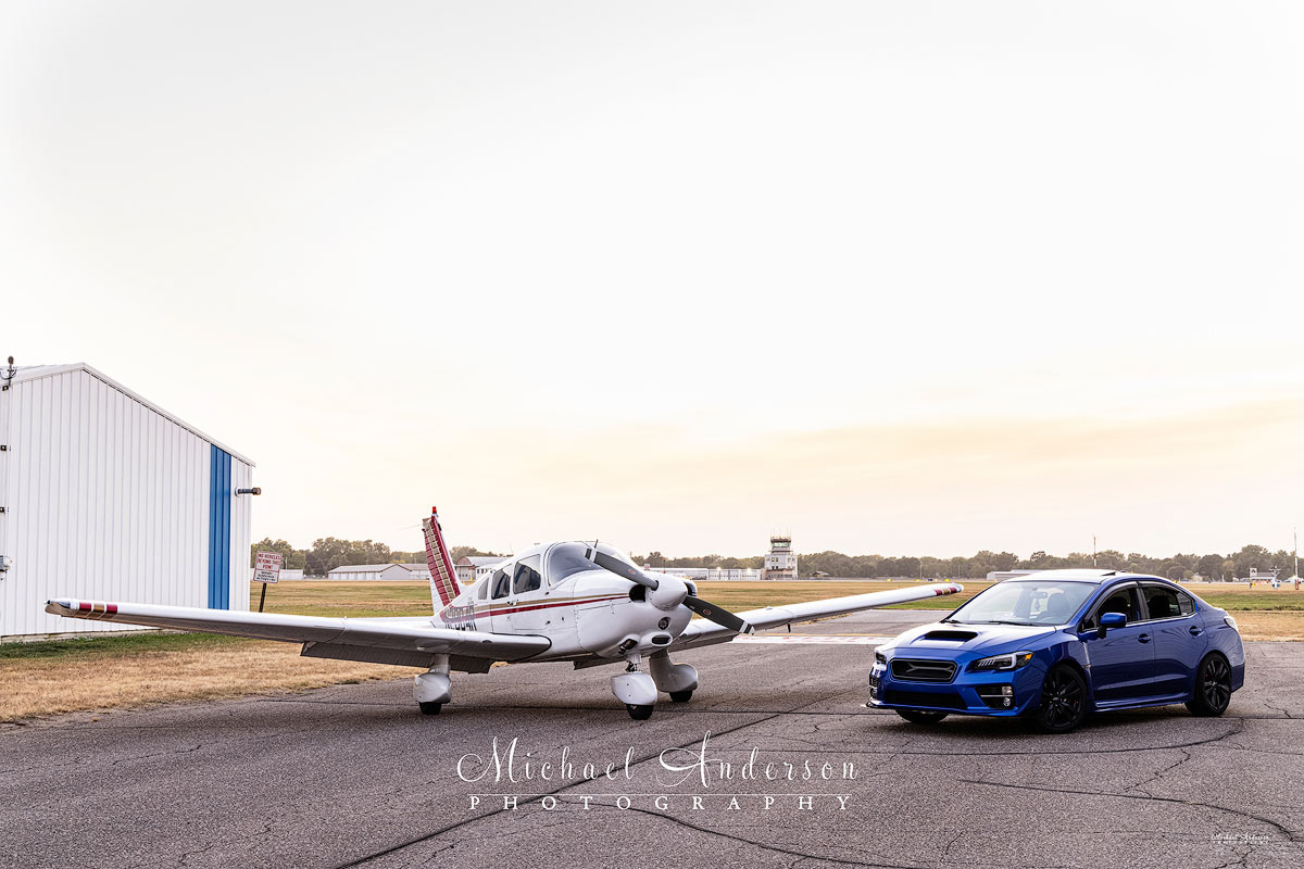 A cool father and son light painted photograph. It includes the son with his Subaru WRX, and Piper Dakota N2904R, which dad flies. The one-of-a-kind image was taken at Club Cherokee at the Crystal Airport (KMIC) in Crystal, Minnesota.