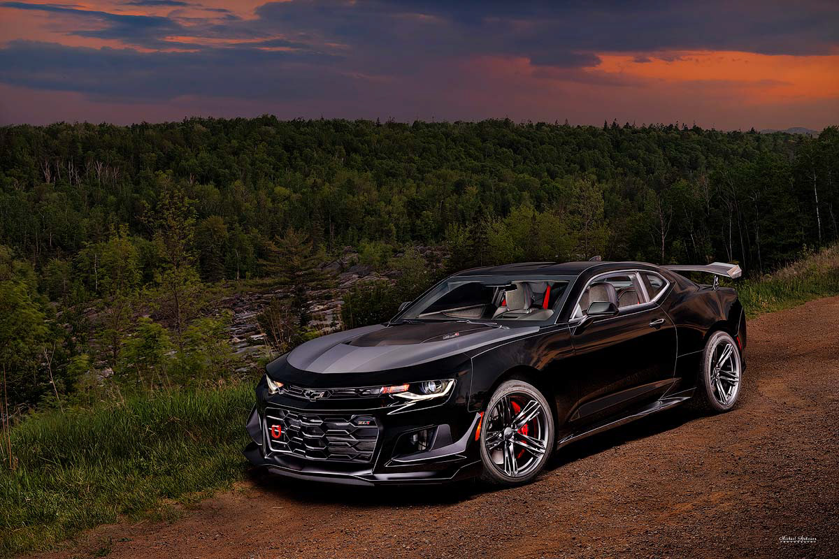 A pretty light painted photograph of a 2018 ZL1 1LE Camaro (Mosaic Black Metallic) in Jay Cooke State Park.