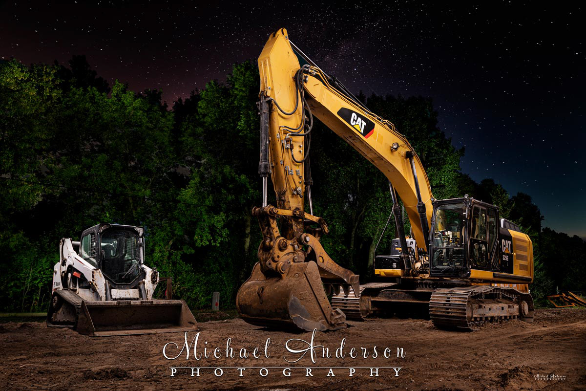 An awesome light painted photograph of a CATERPILLAR 329 E L and a Bobcat T590 at a construction site in New Brighton, Minnesota.