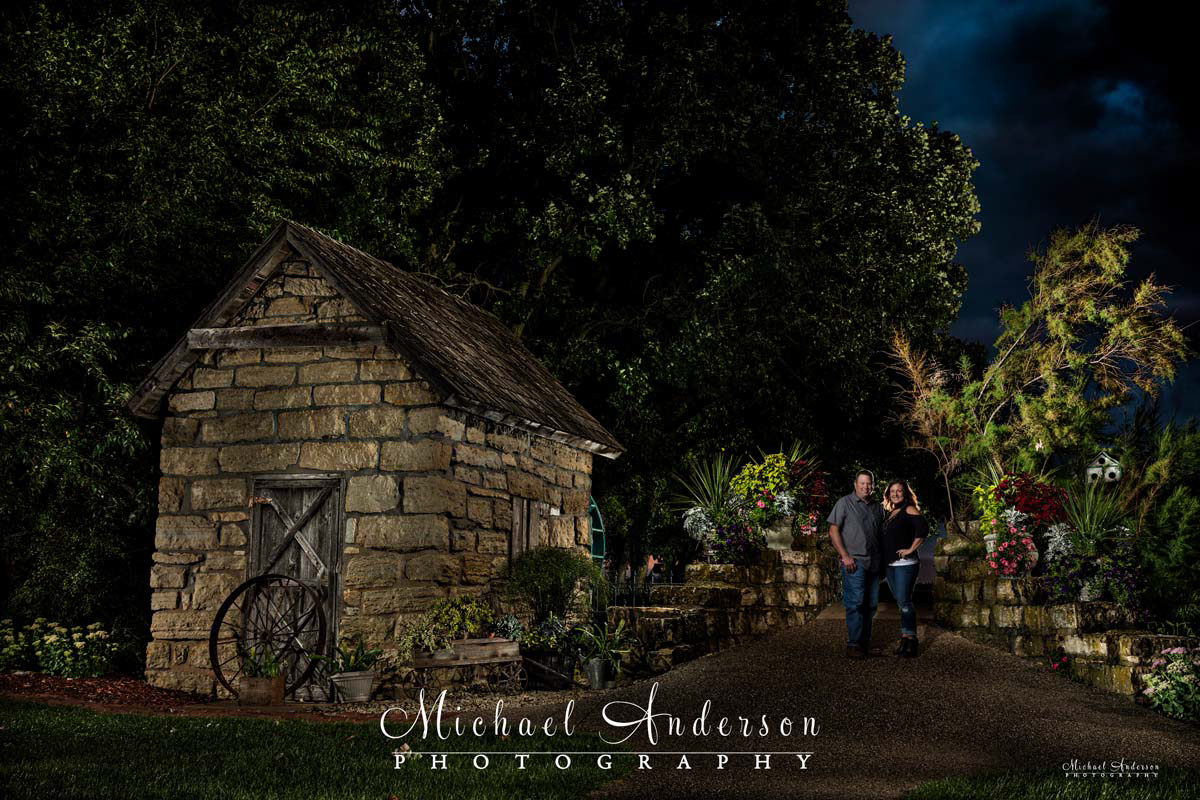 A cool light painted engagement photo created at the Country Grist Mill located at Little Log House Pioneer Village in Hastings, MN.