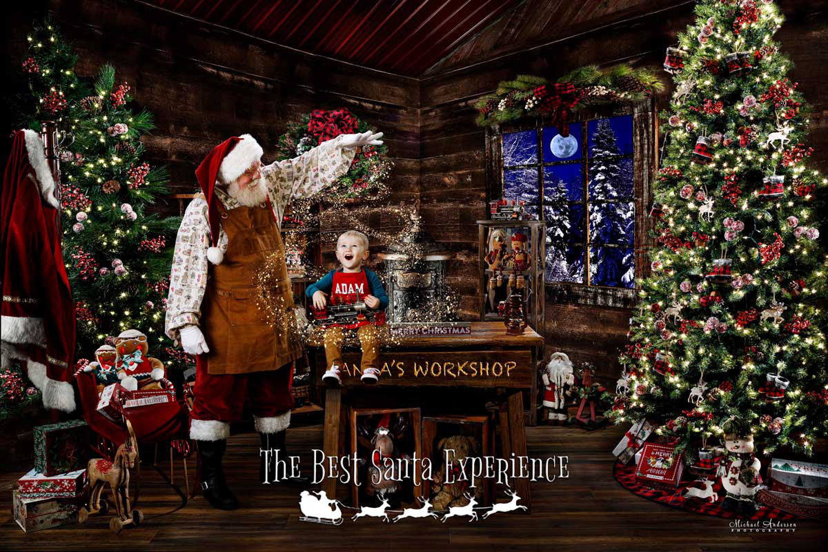 A beautiful Christmas photograph of a little boy in Santa's Workshop. The photograph was created, in part, using a photographic process called light painting.