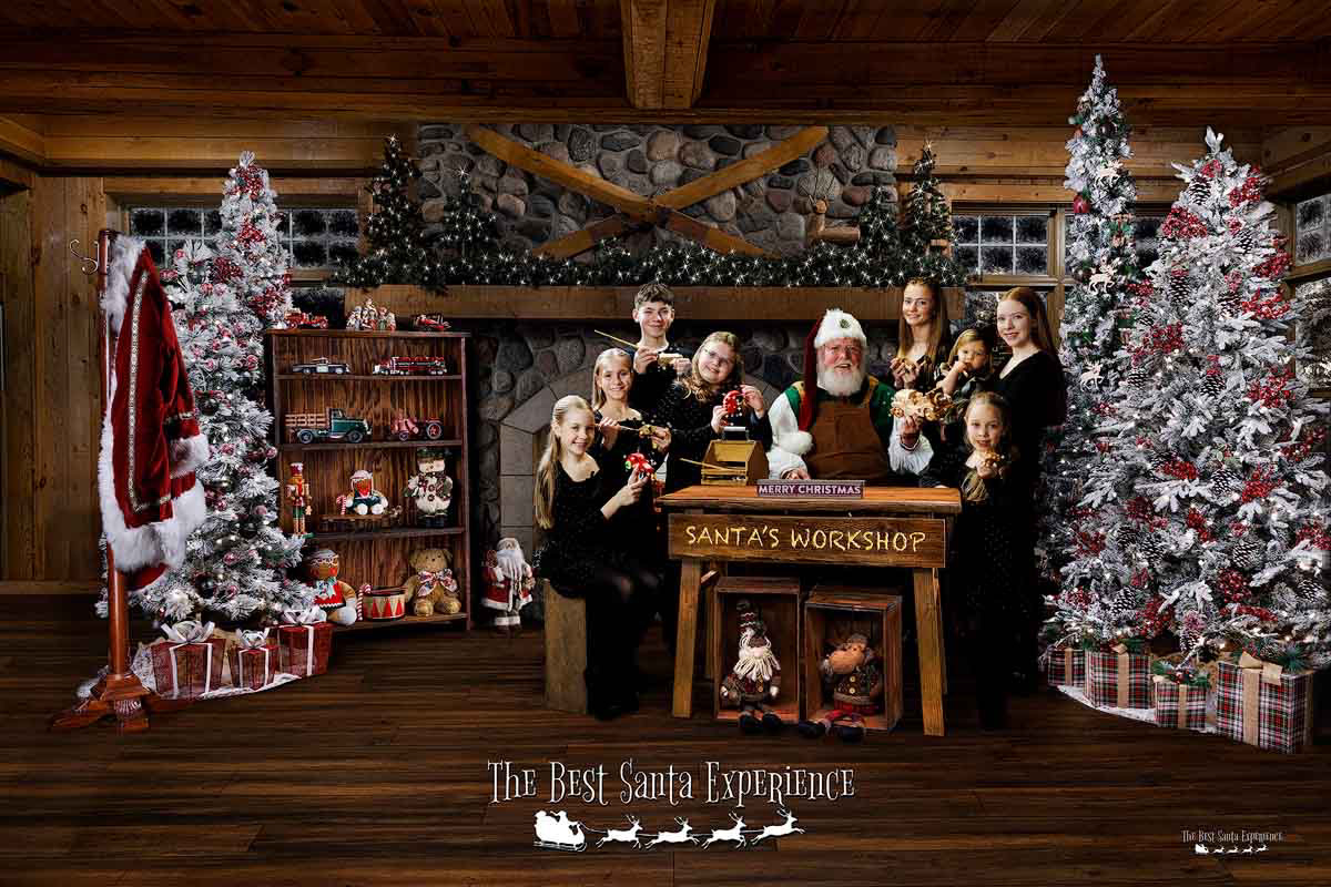 A wonderful Christmas photograph of Santa Claus with eight cousins in his Magic Workshop. This annual tradition is part of The Best Santa Experience created by Michael Anderson Photography in Mounds View, Minnesota.